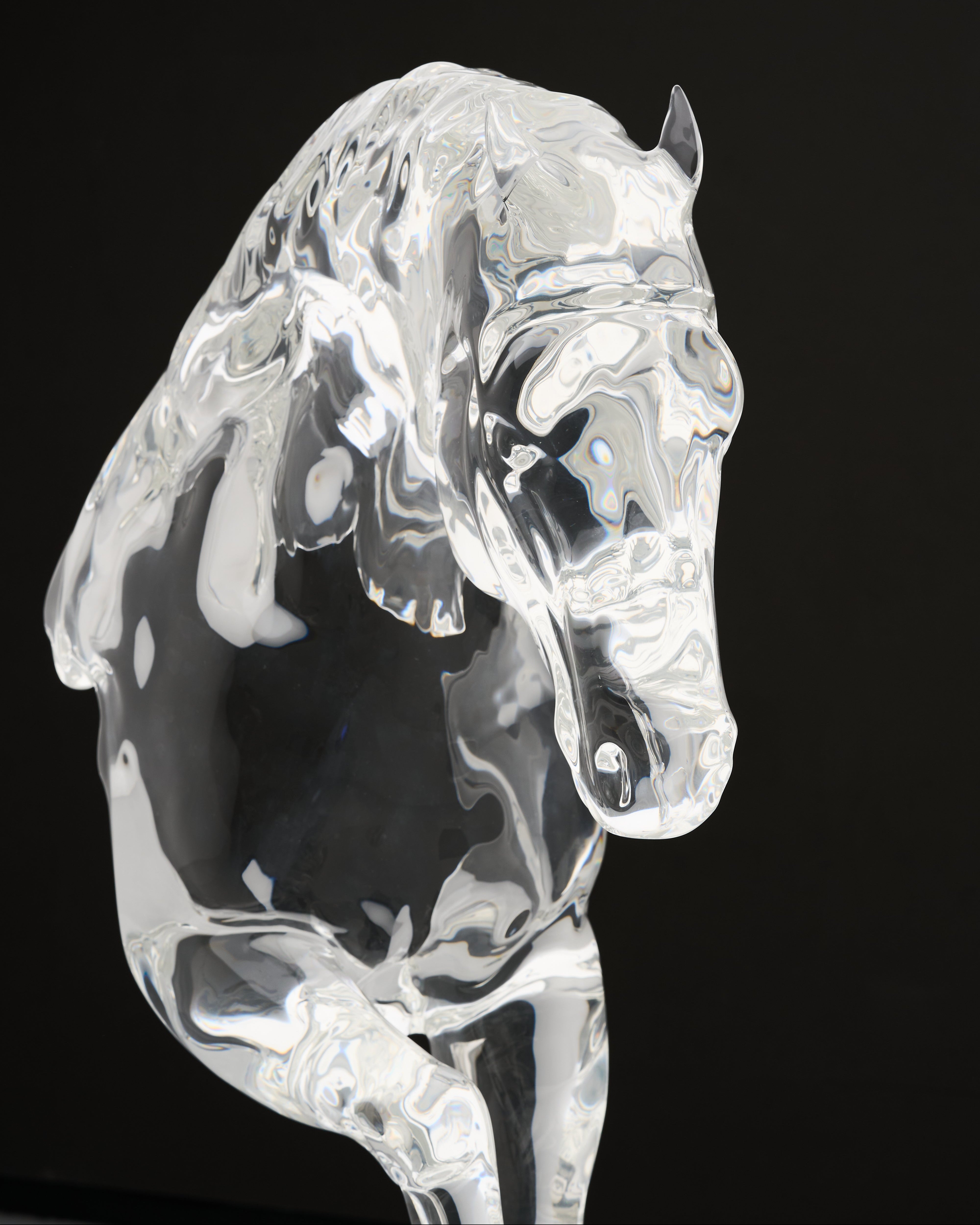 Crystal horse figurine on a black background