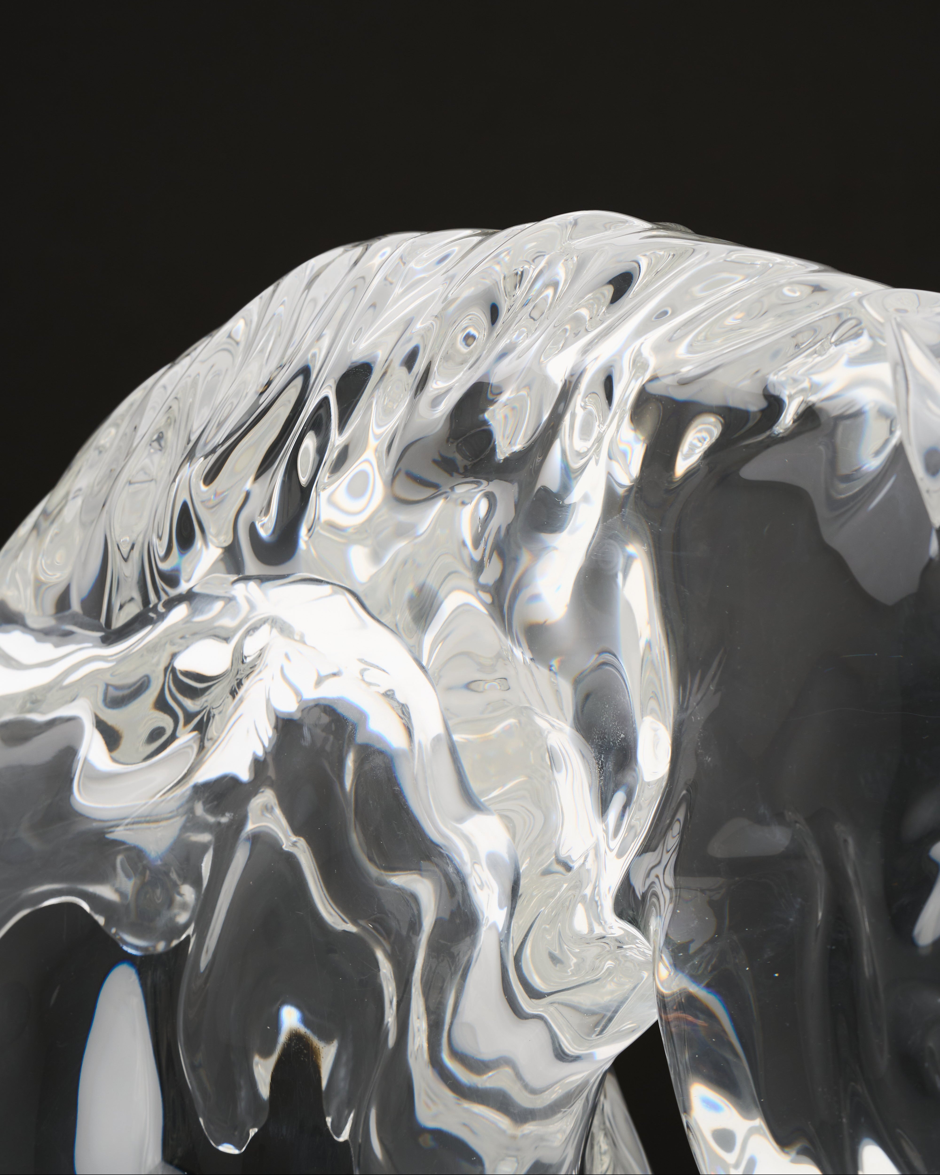 Close-up of a textured, reflective surface with black and gray tones.