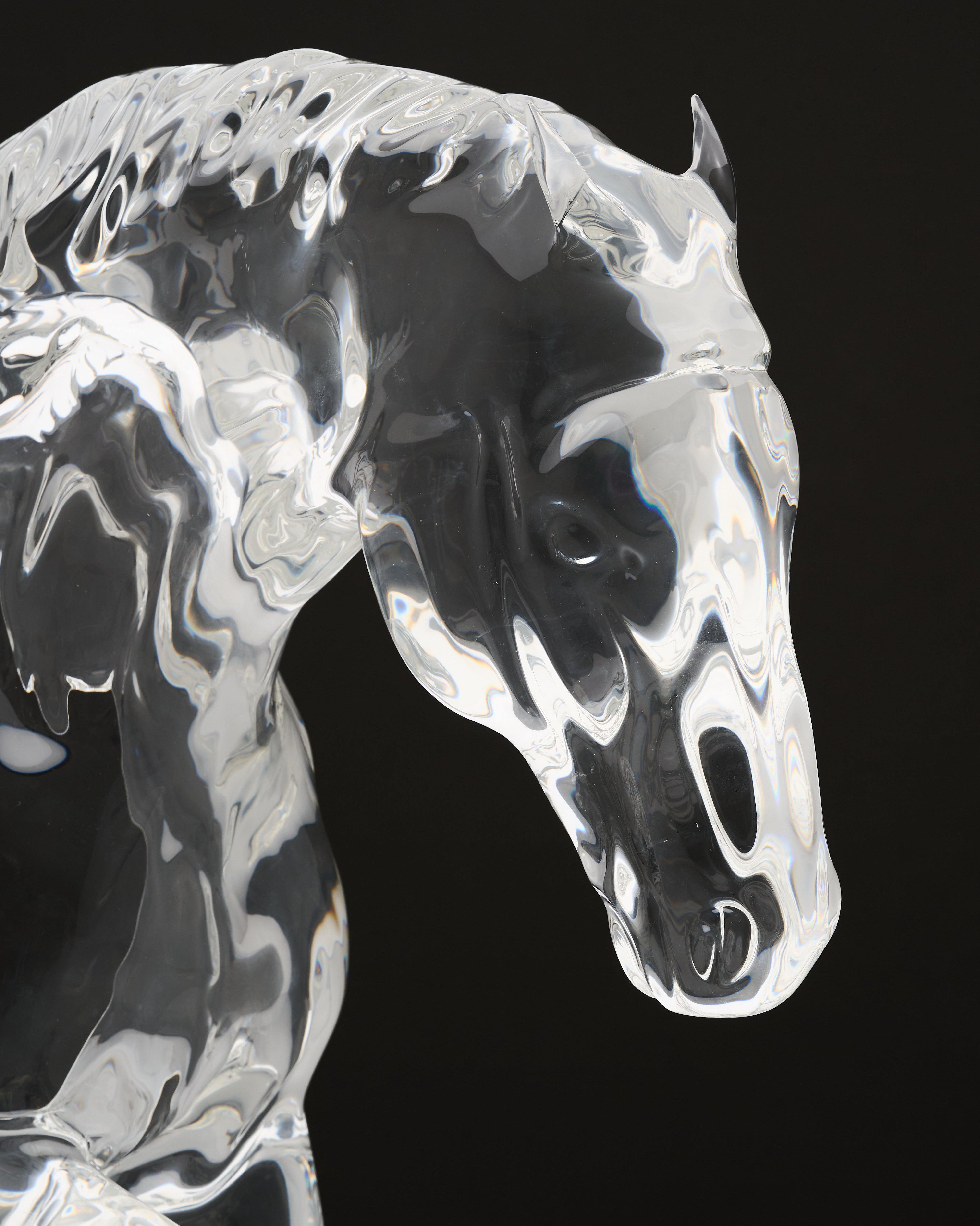 Crystal horse figurine on a black background