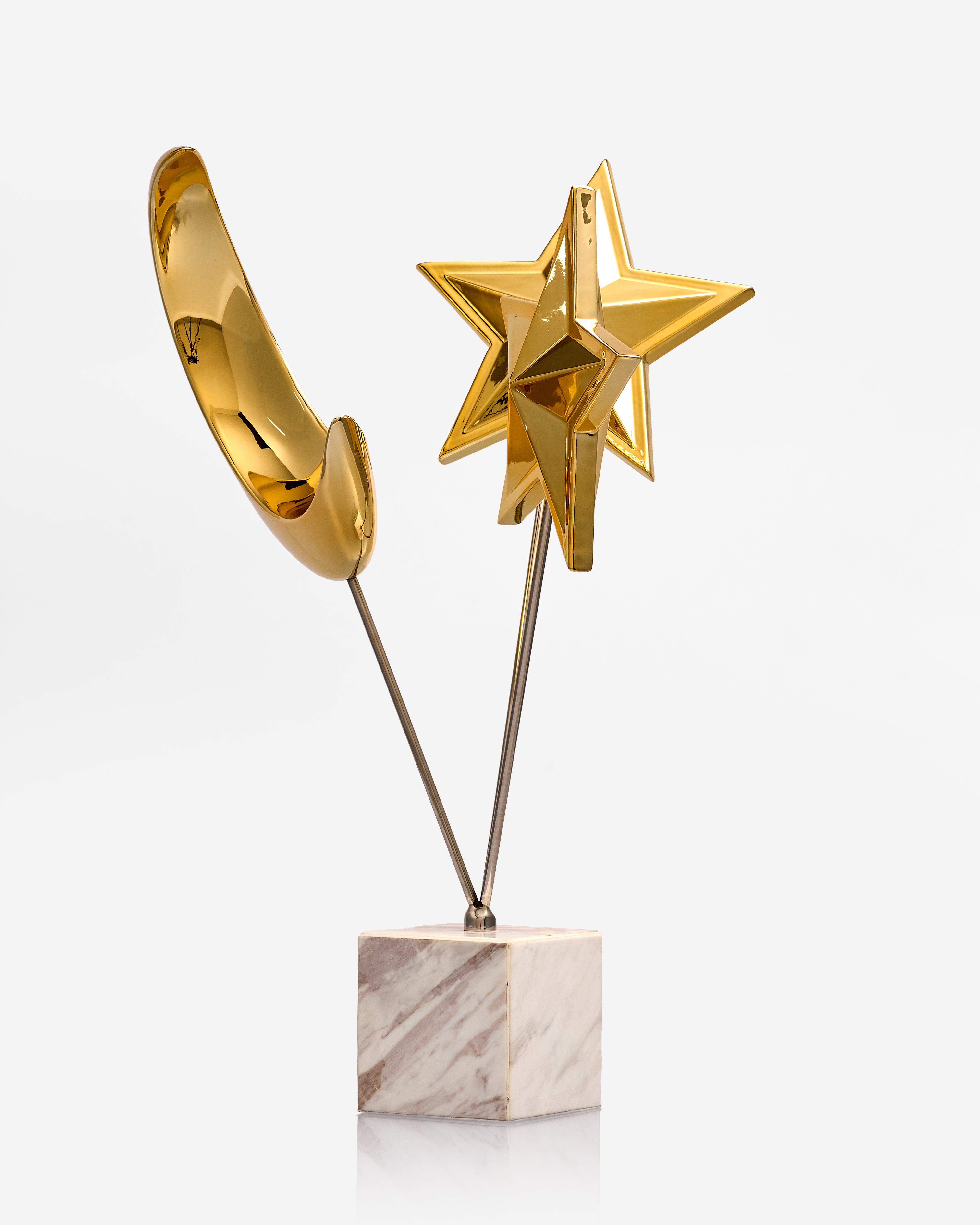 Gold star-shaped trophy on a marble base against a white background