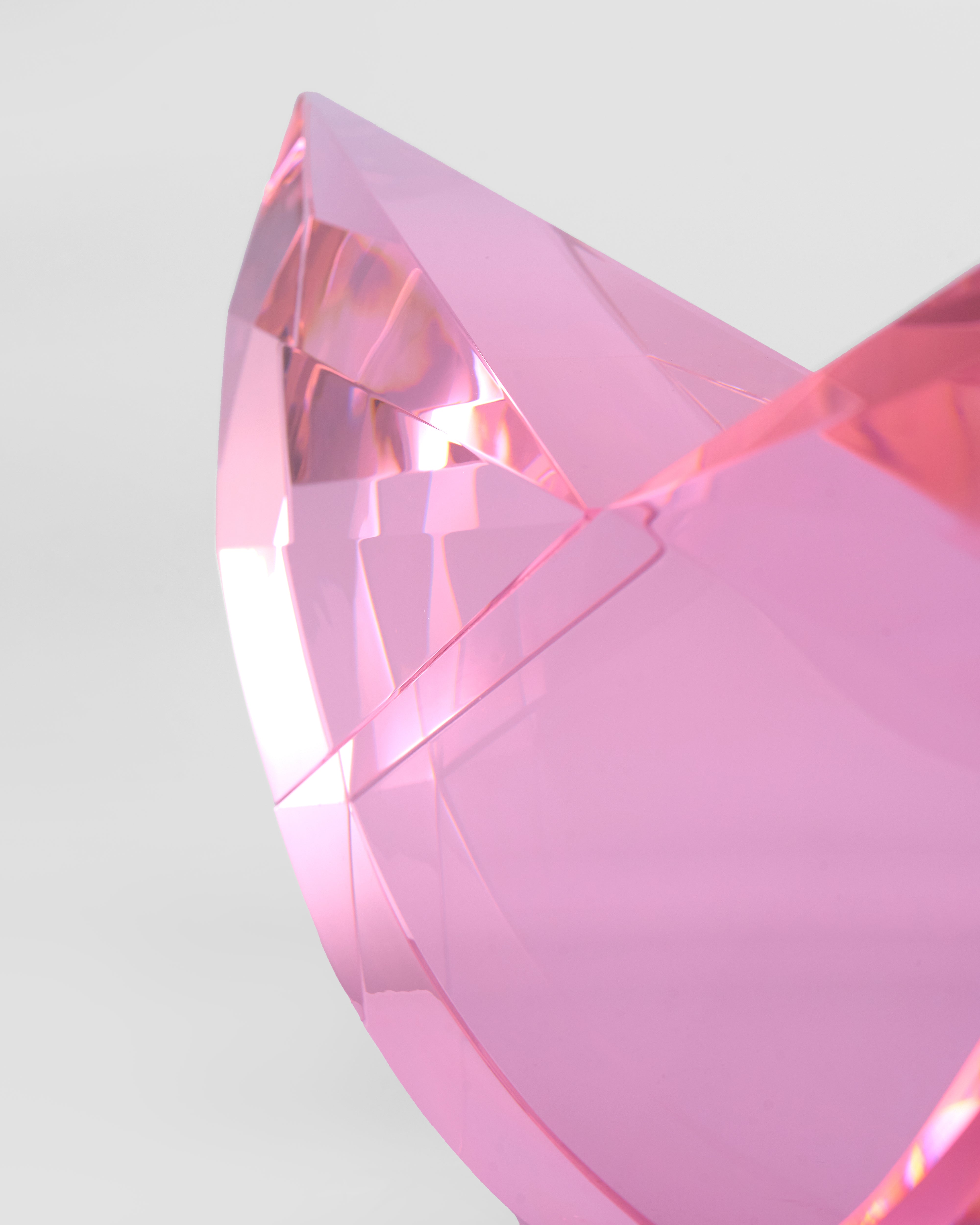 Close-up of a pink crystal with a clear background