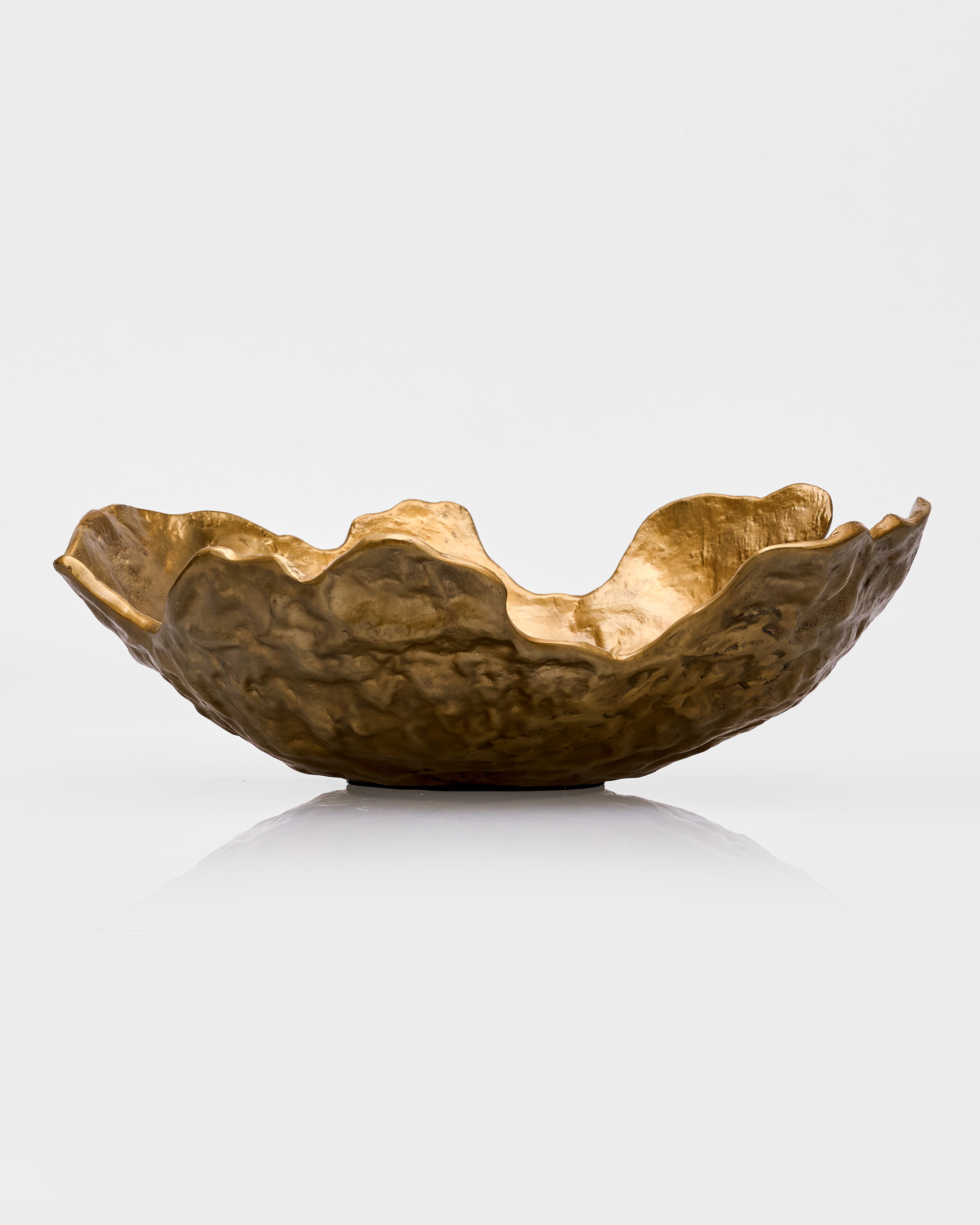 Gold decorative bowl bronze on a white background