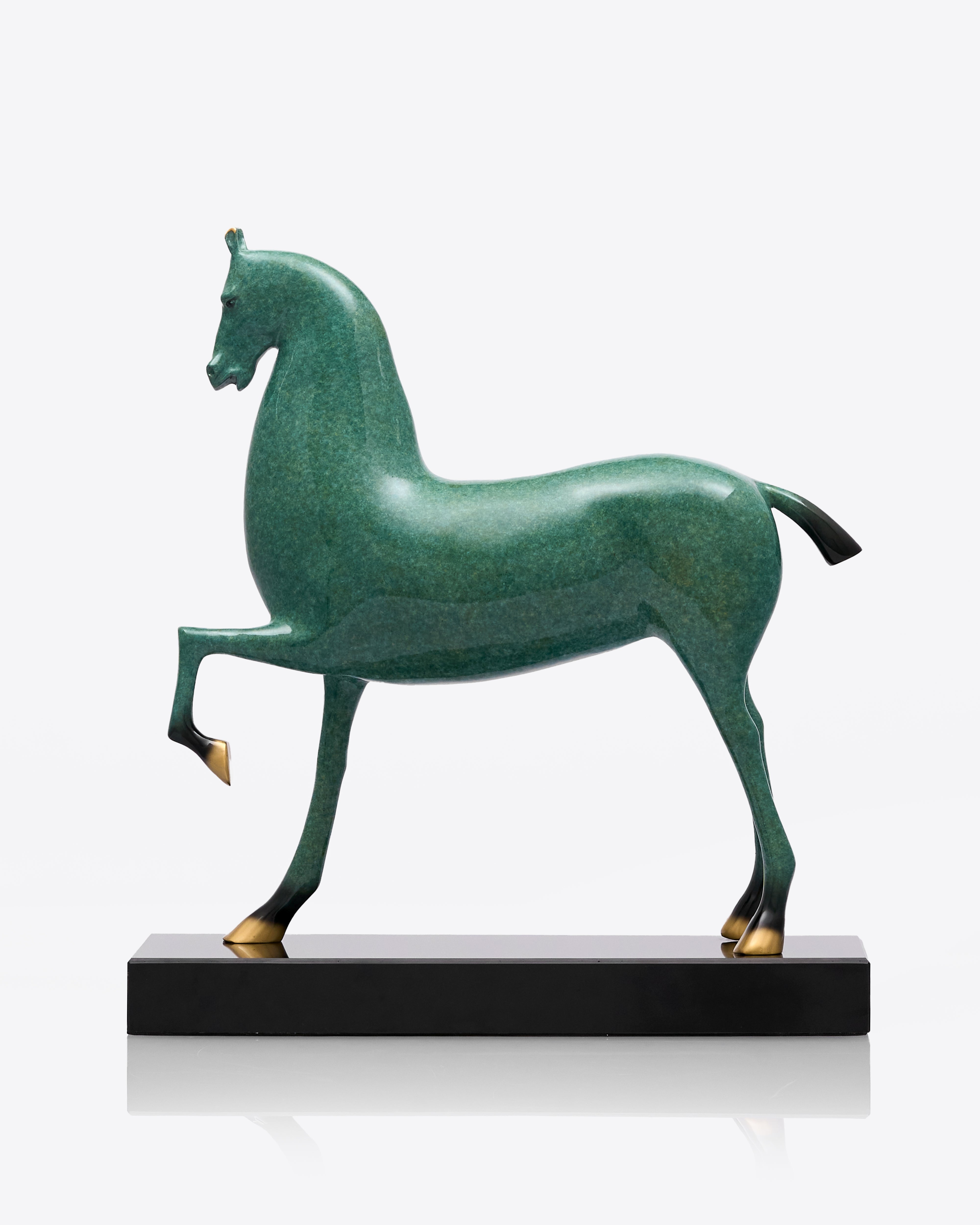 Green horse sculpture on a white background
