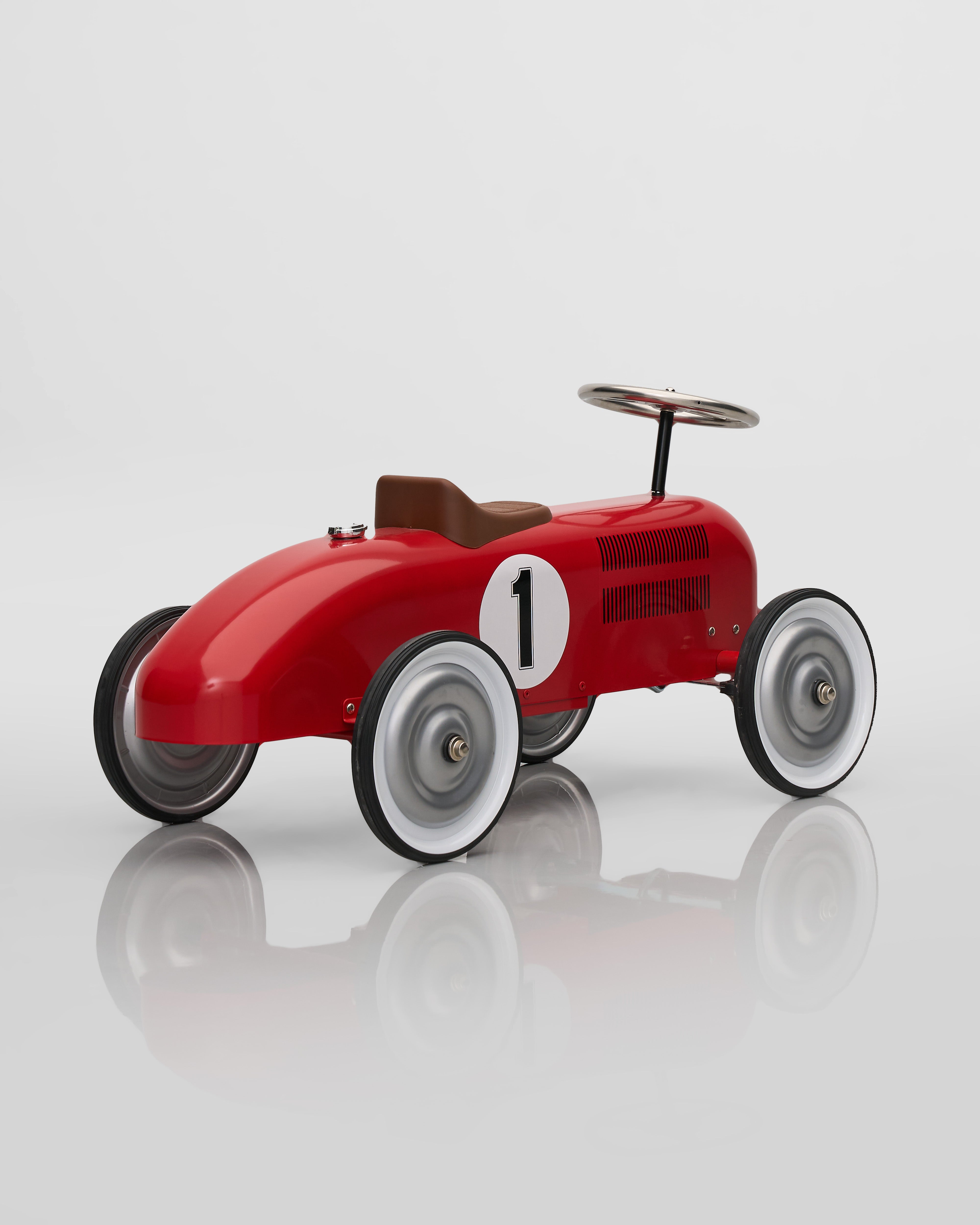 Red toy race car with number 1 on a white background