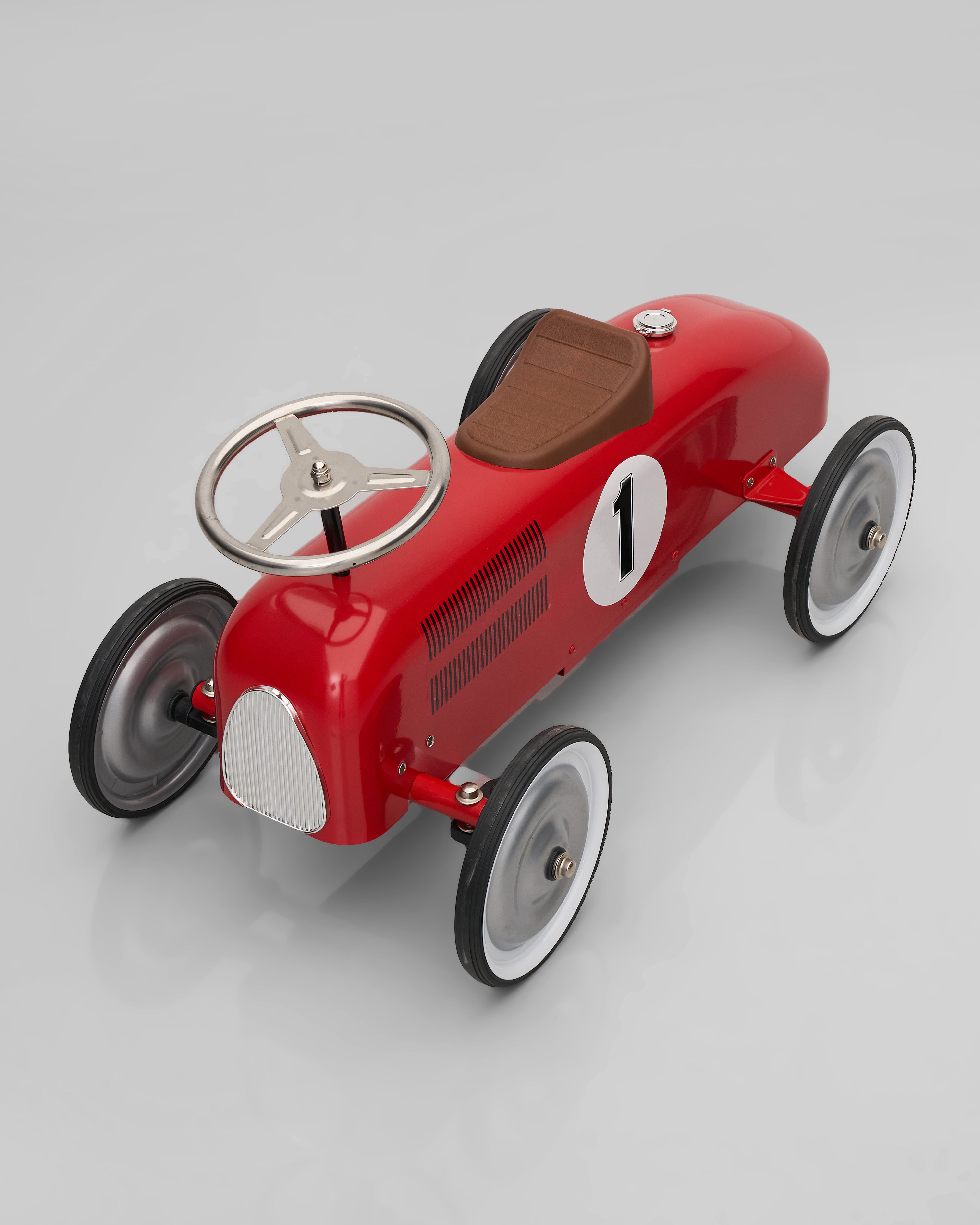 Red vintage-style decor top angle toy car on a gray background