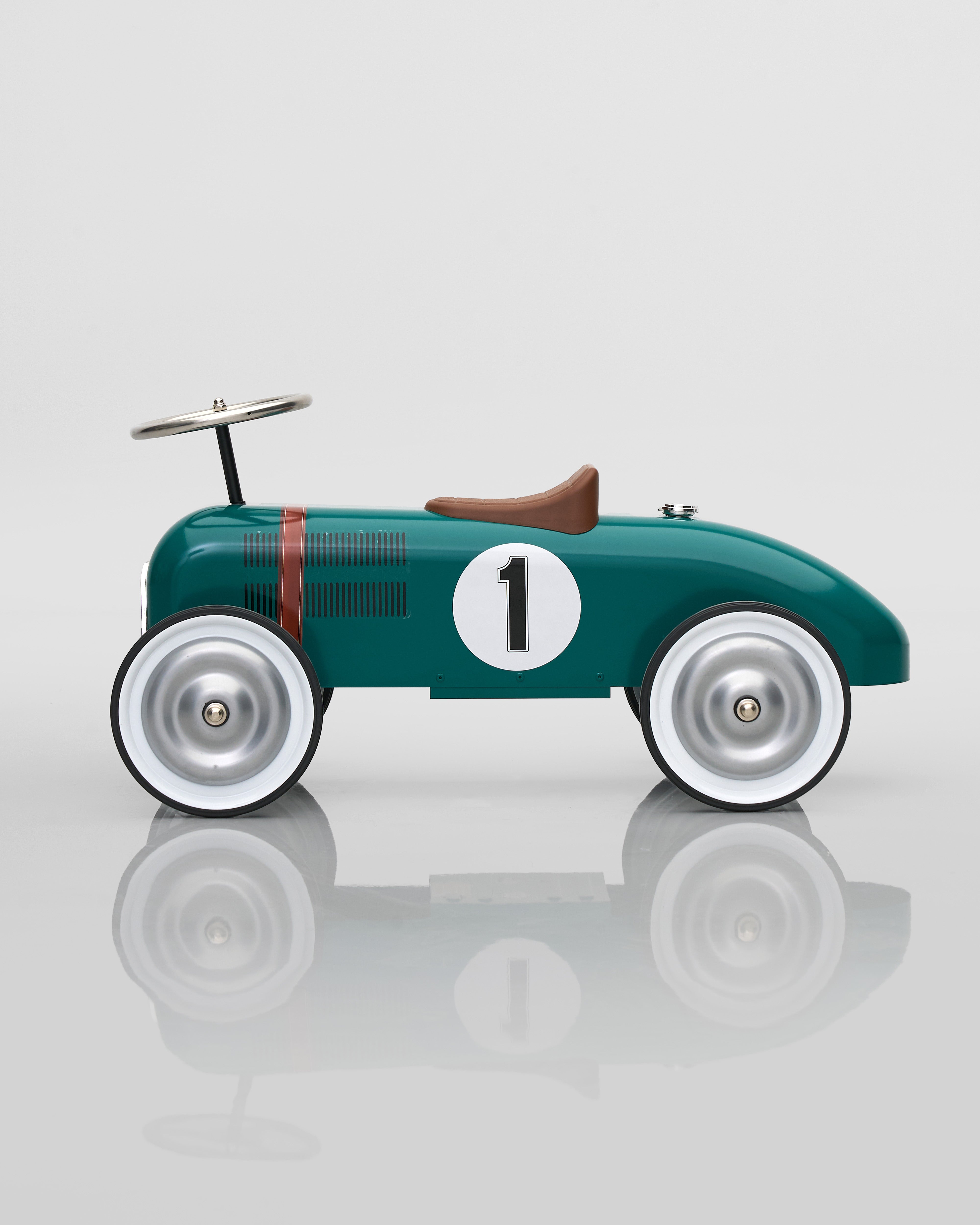 Vintage-style toy car decor with number 1 on a reflective surface