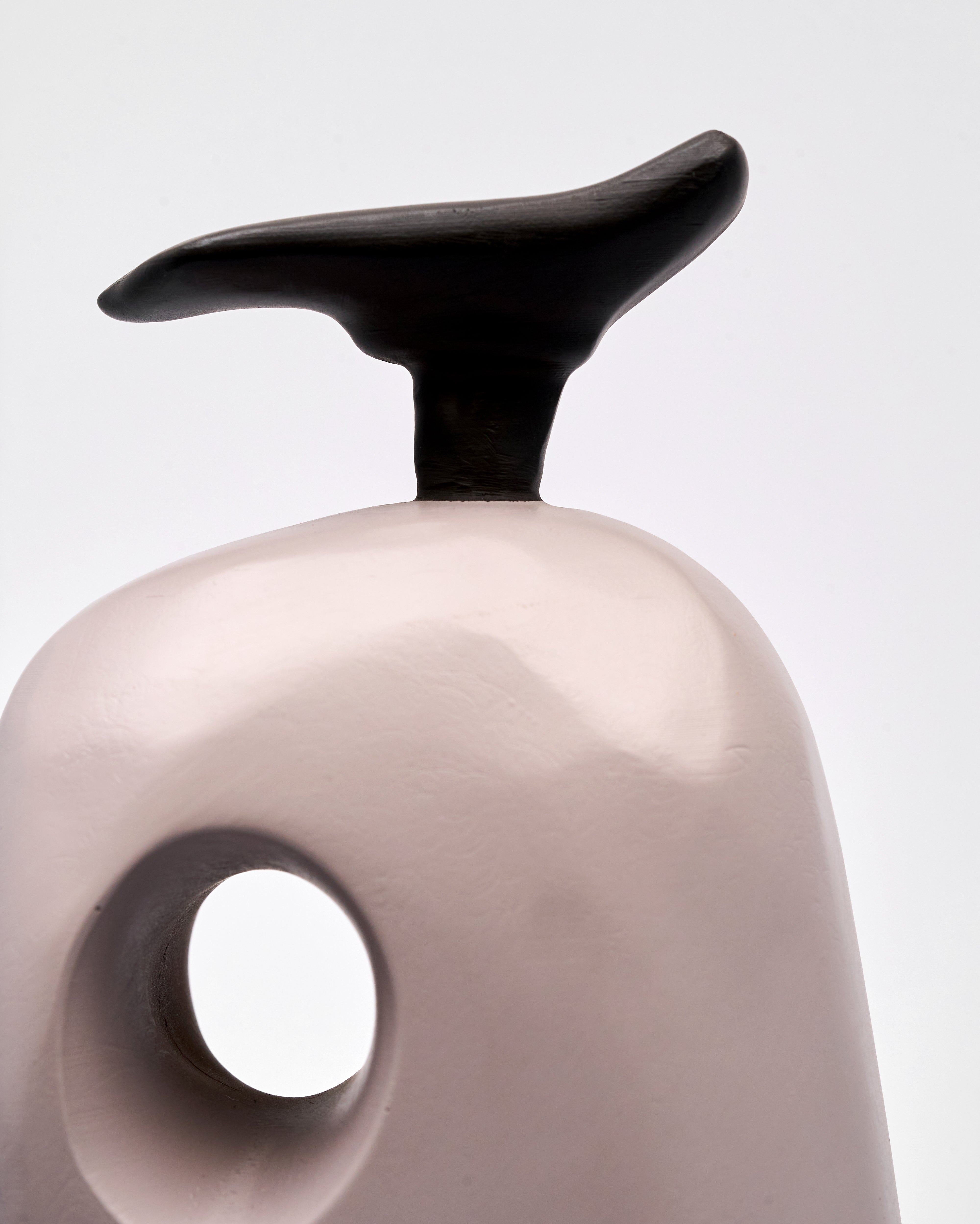 wood vase with black handle on a white background