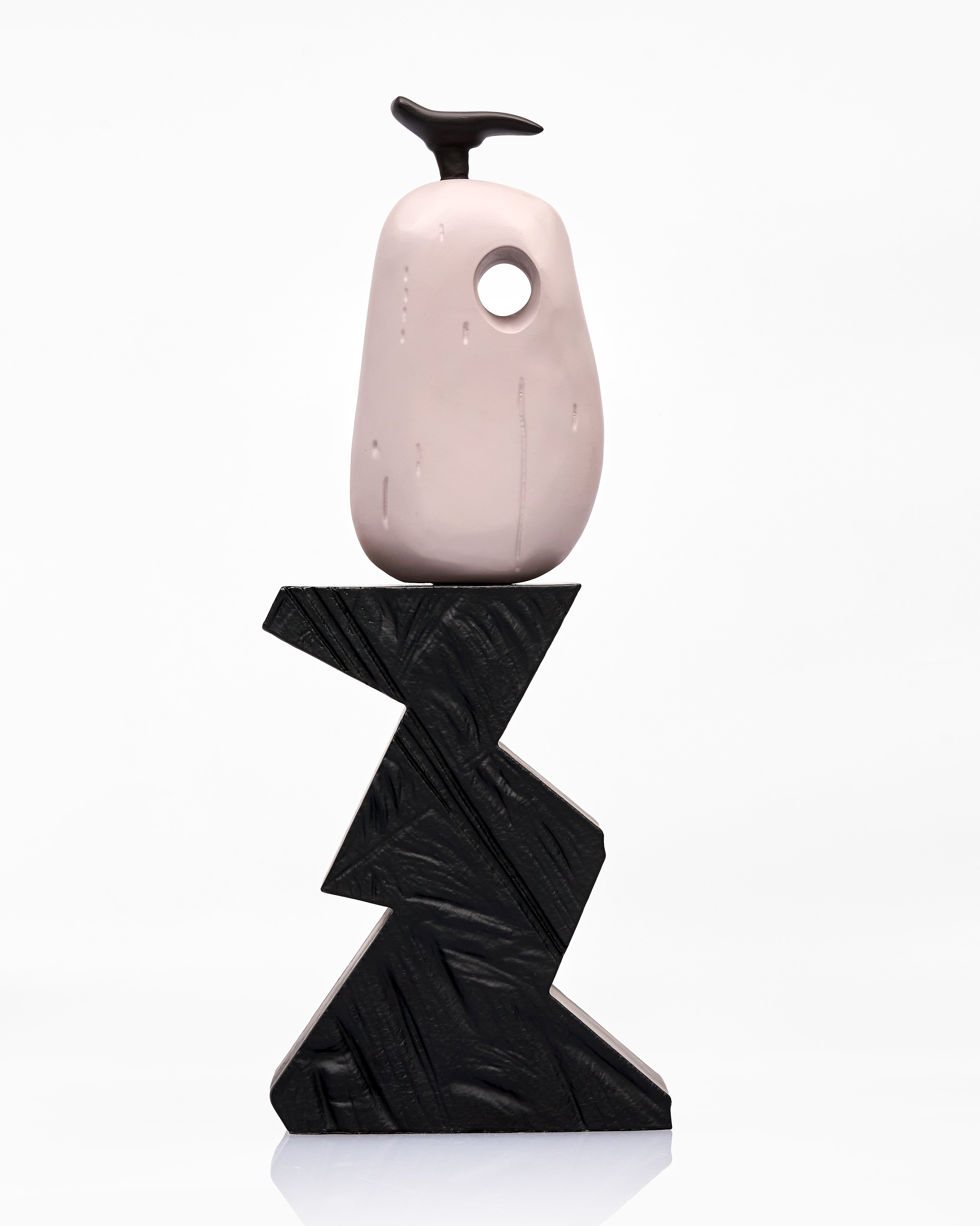 wooden vase with a black base on a white background