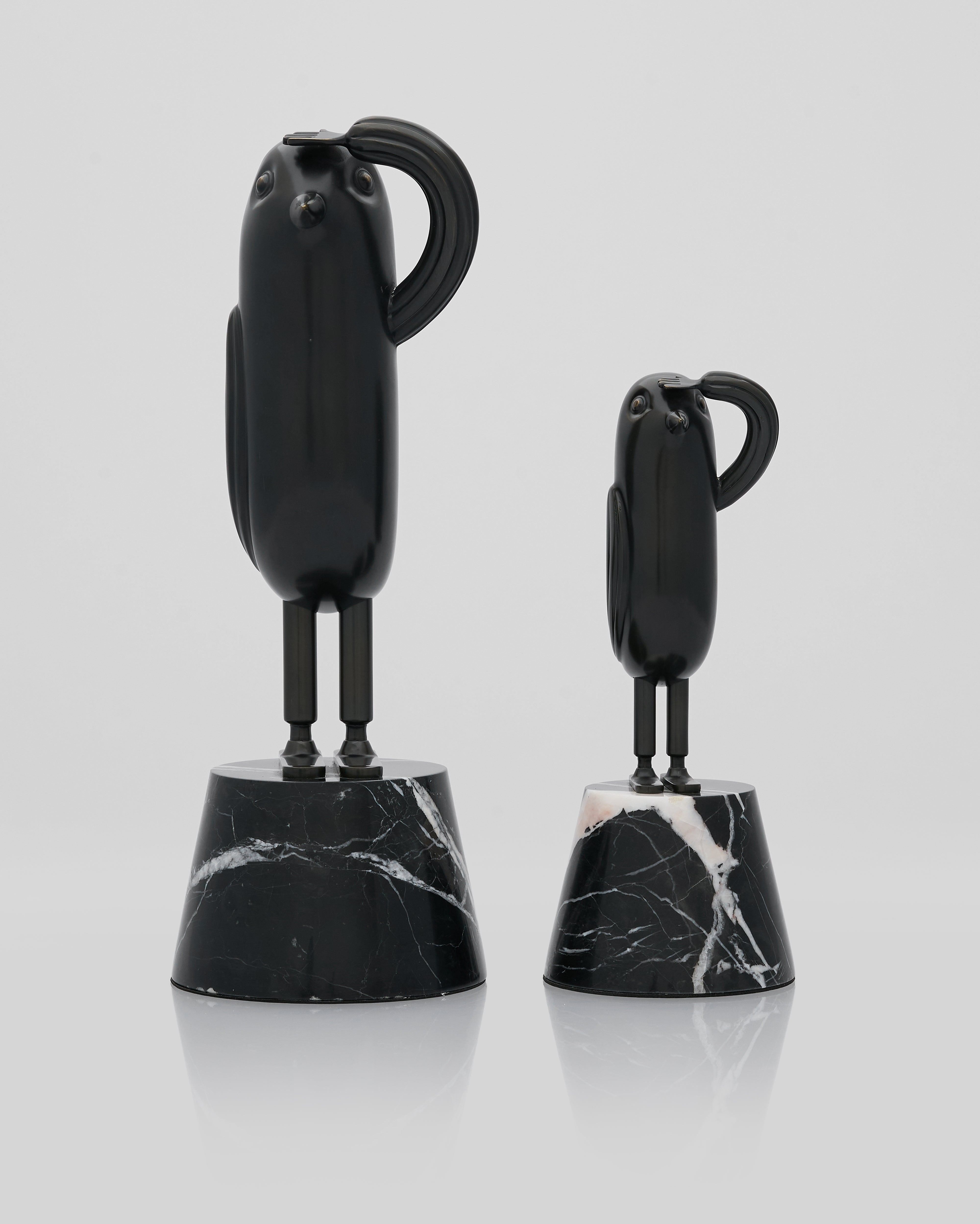 Black marble effect salute character figurine with base on a white background