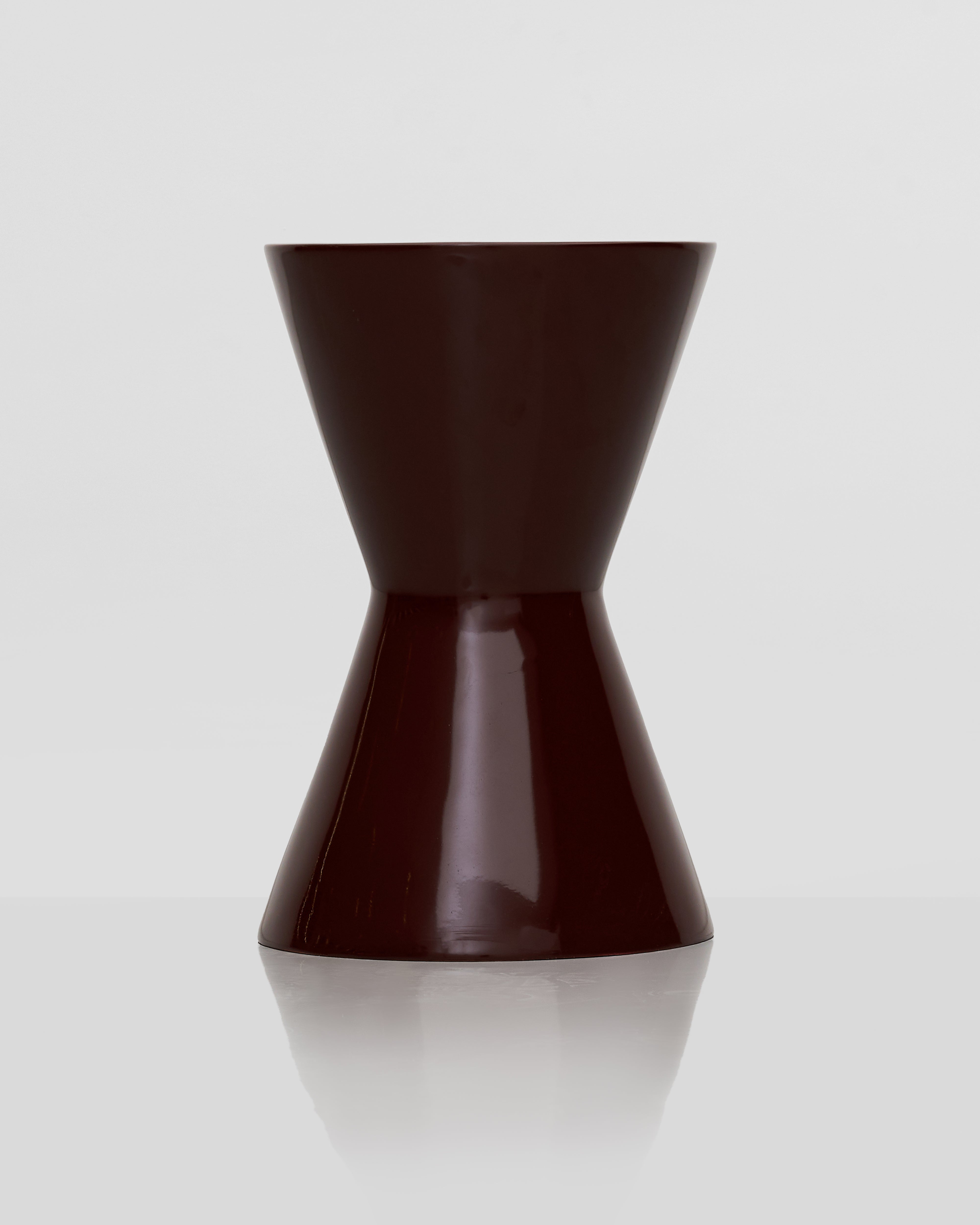 Front view of Alexa side table showcasing elegant form and smooth premium finish