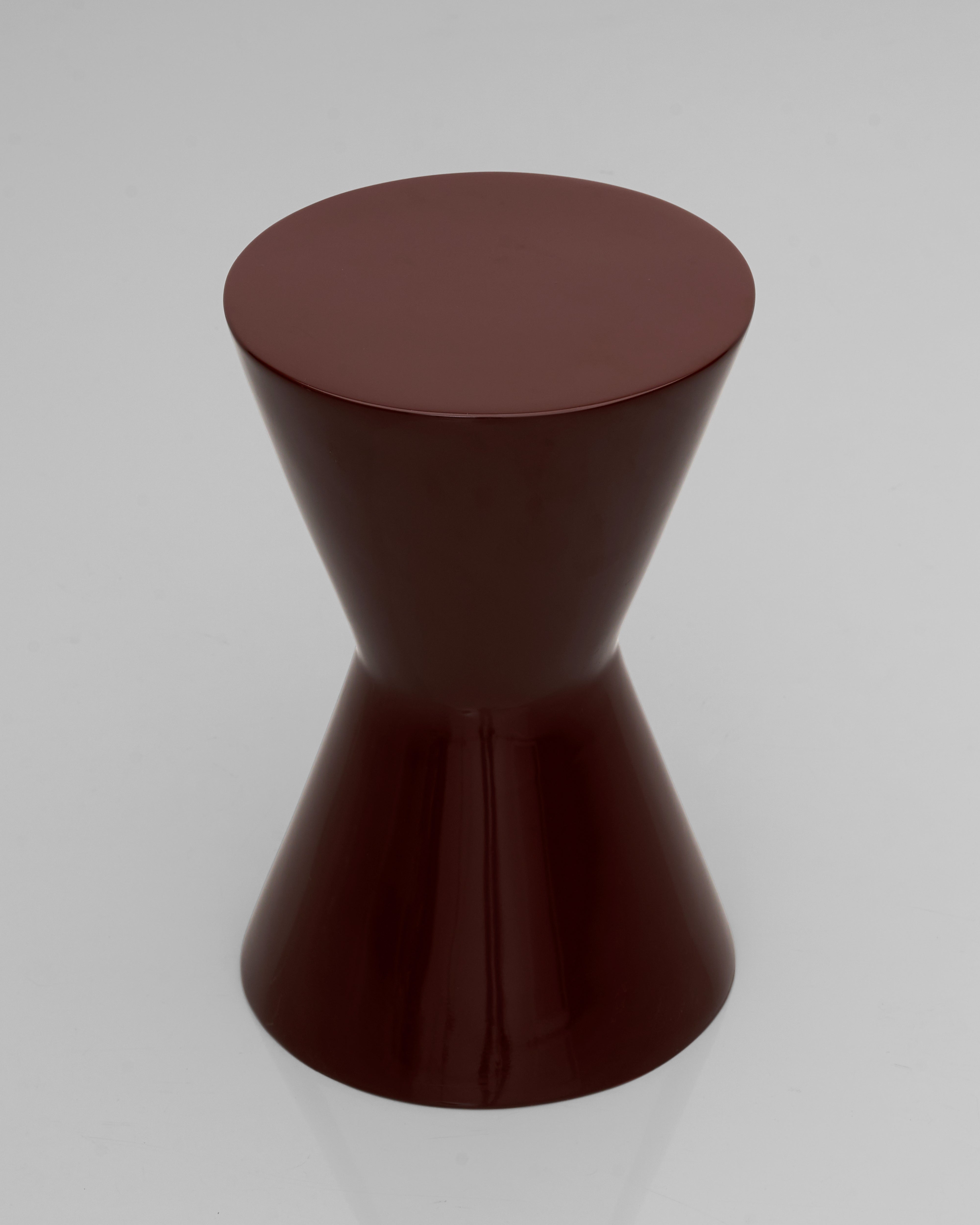 Side view of Alexa side table highlighting sculptural silhouette and modern craftsmanship
