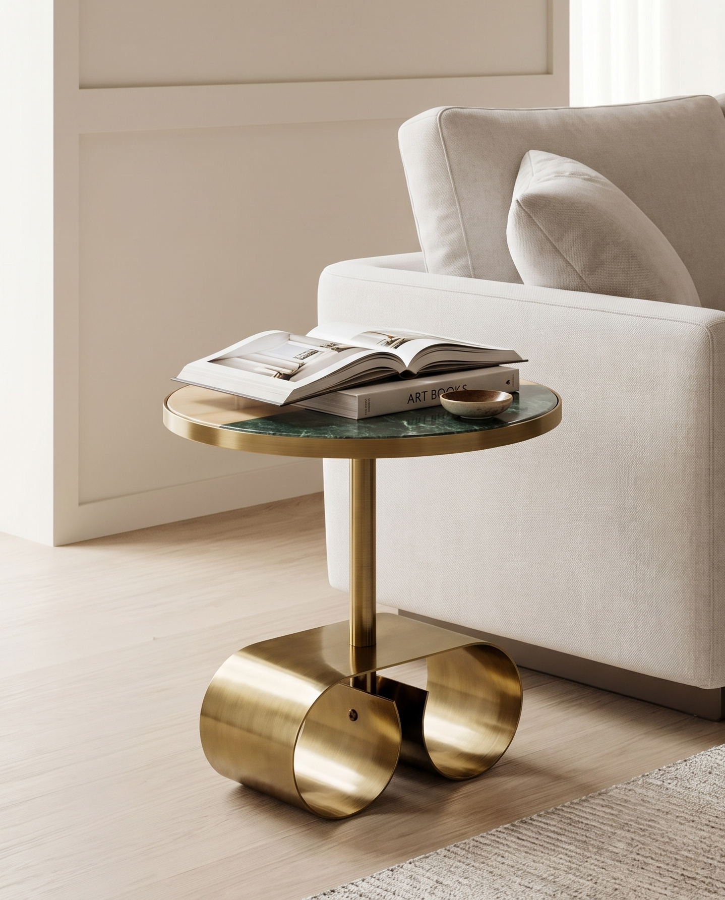 Modern living room with a beige sofa and gold side table.