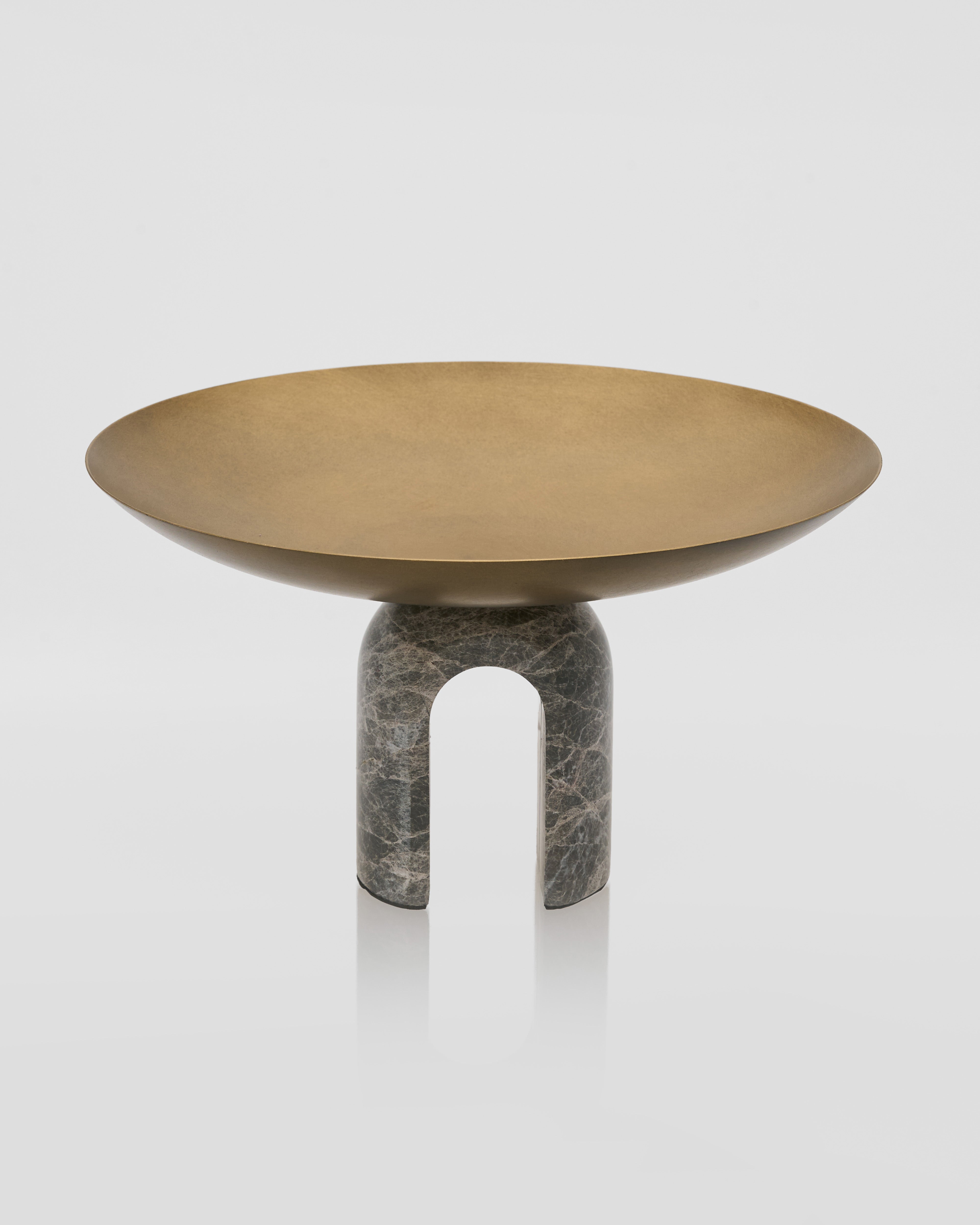 Close-up of antique metal marble tray highlighting smooth marble polish and refined craftsmanship