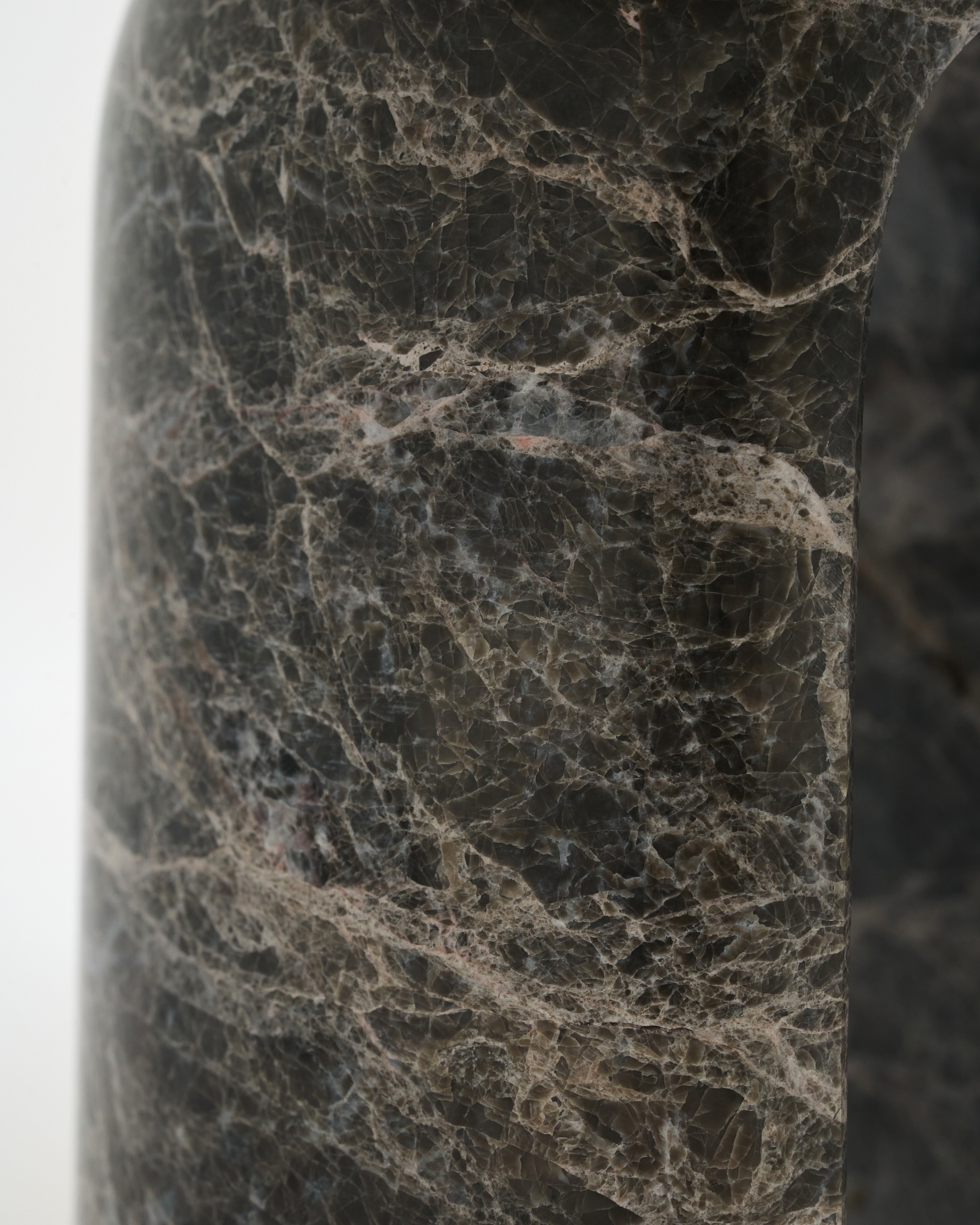 Close-up of a dark marble or stone surface with visible veins.