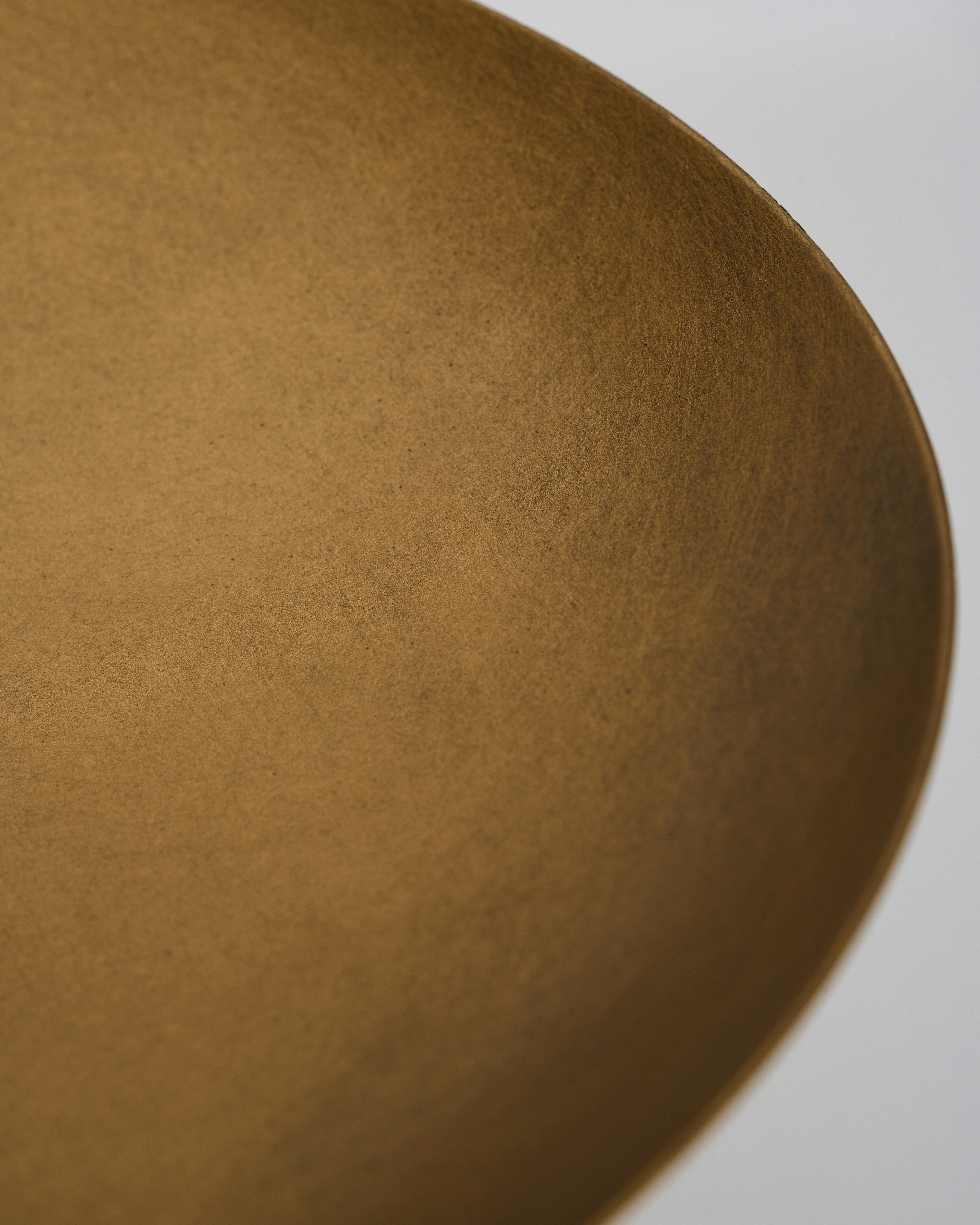 Close-up of antique metal marble tray detailing natural marble texture and vintage metal finish