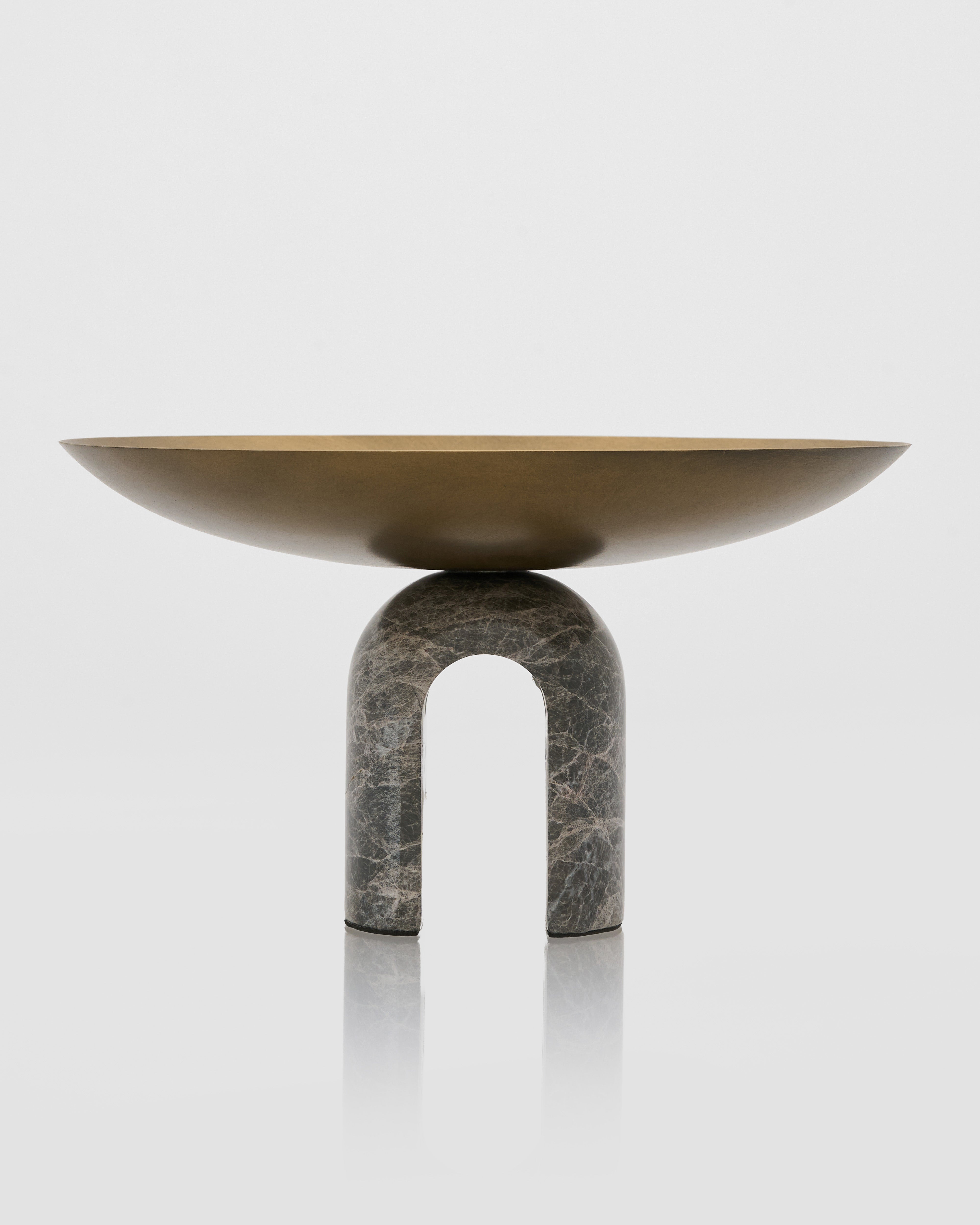 Modern bowl with a stone-like base on a white background