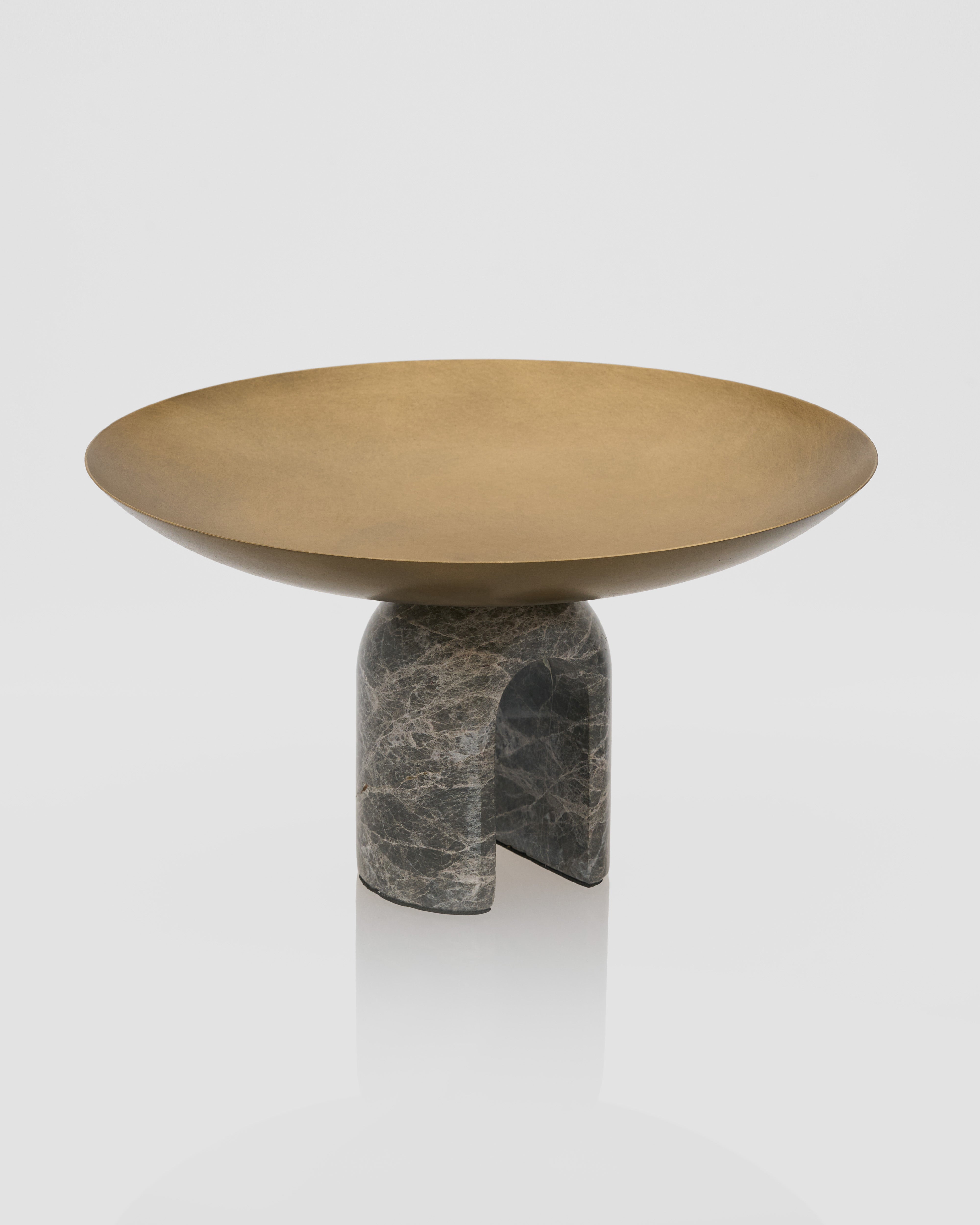 Side view of antique metal marble tray highlighting curved marble base and refined metal detailing