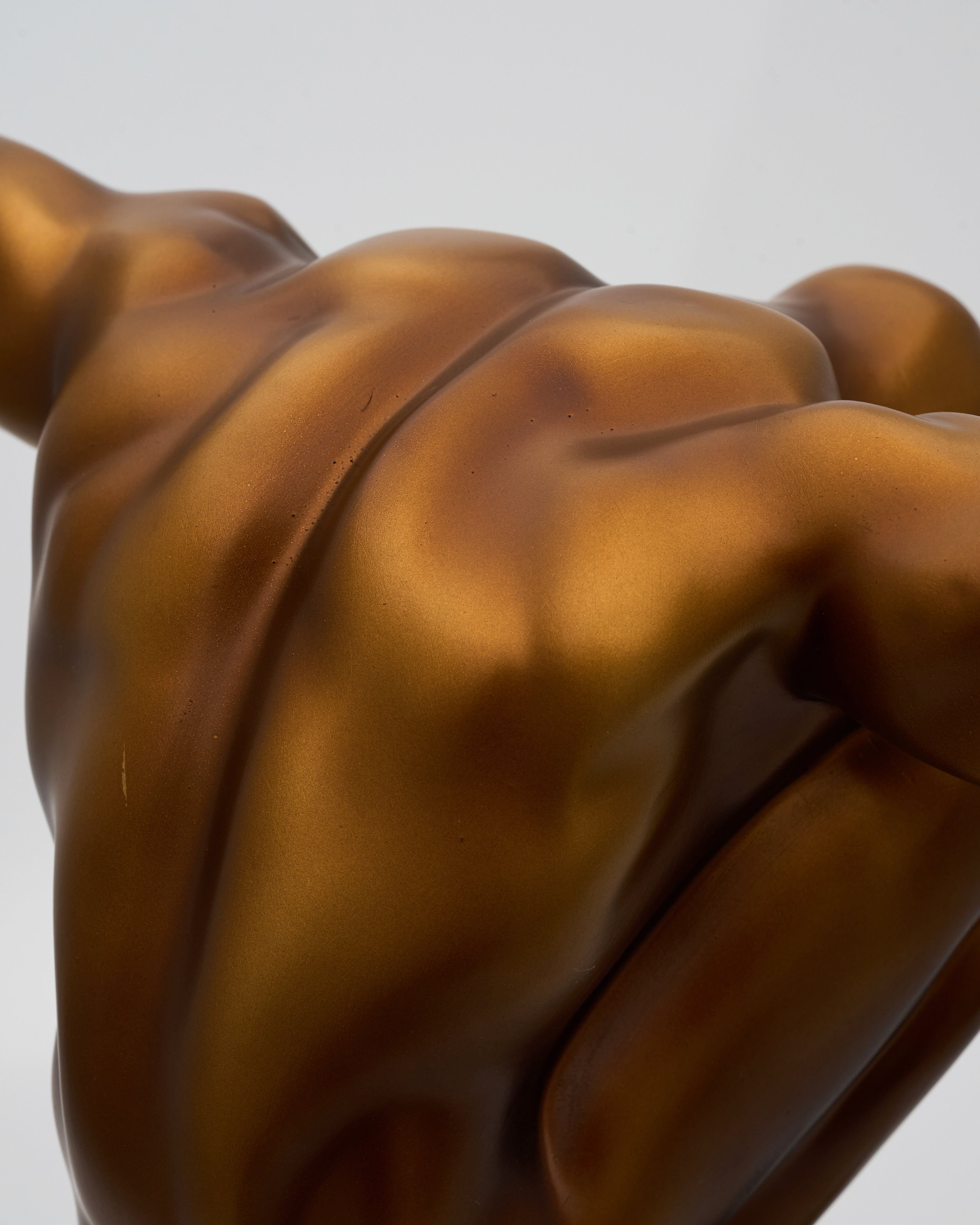 Detailed texture and finish of athletic male posture sculpture showcasing refined craftsmanship and luxury appeal