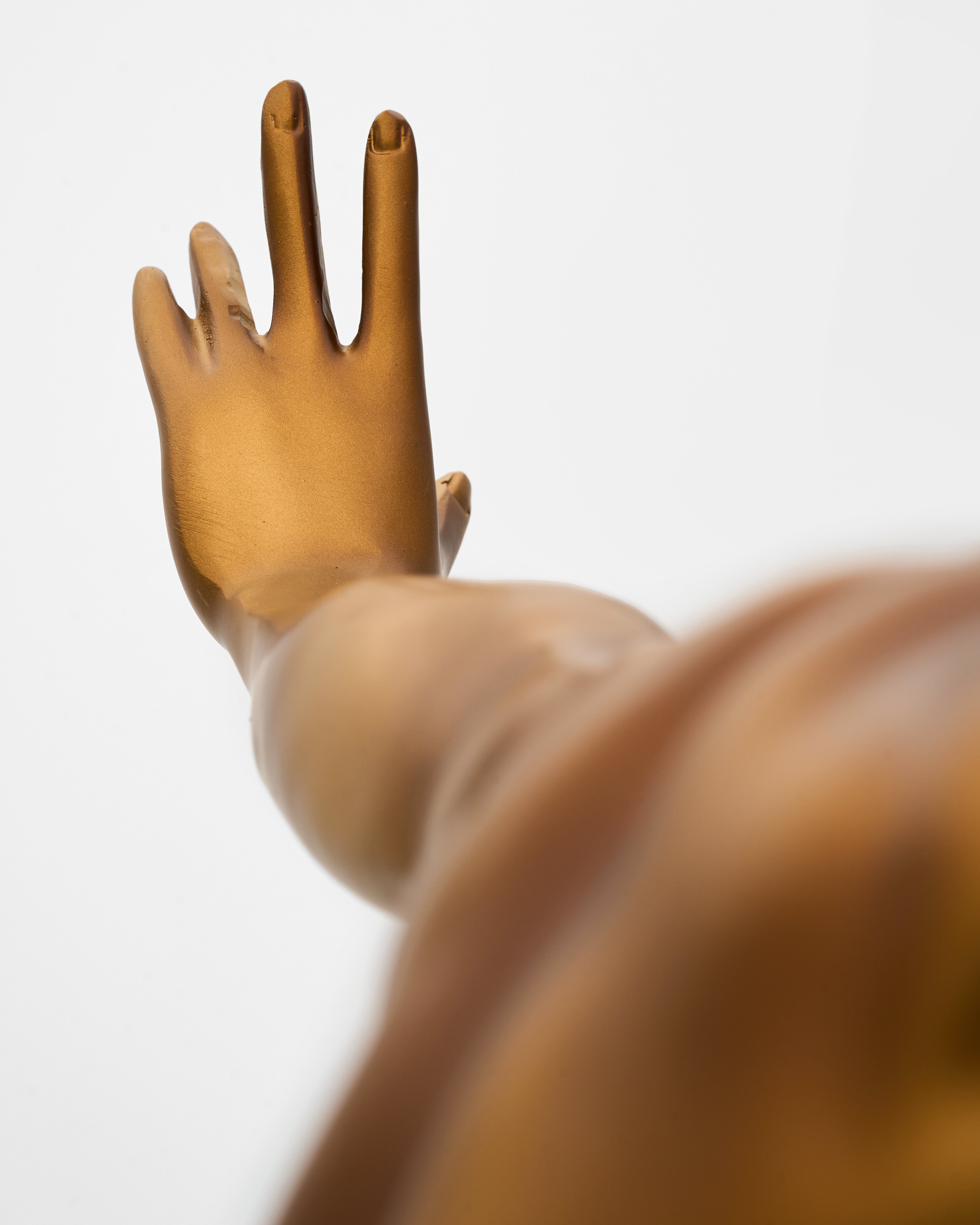 Close-up of athletic male posture sculpture detailing textured surface and premium craftsmanship