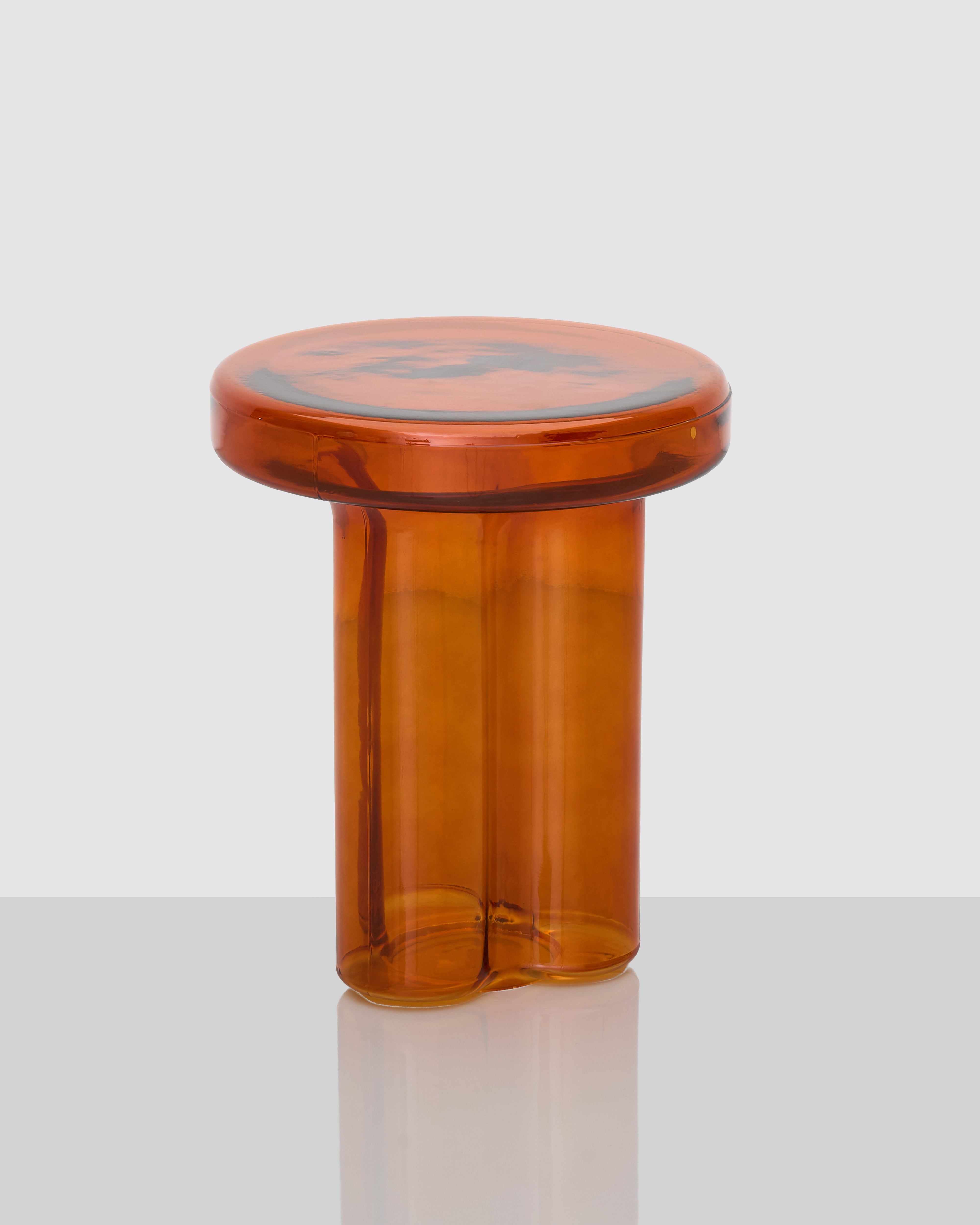 Side view of Avored Glass Side Table highlighting sleek glass silhouette and functional surface