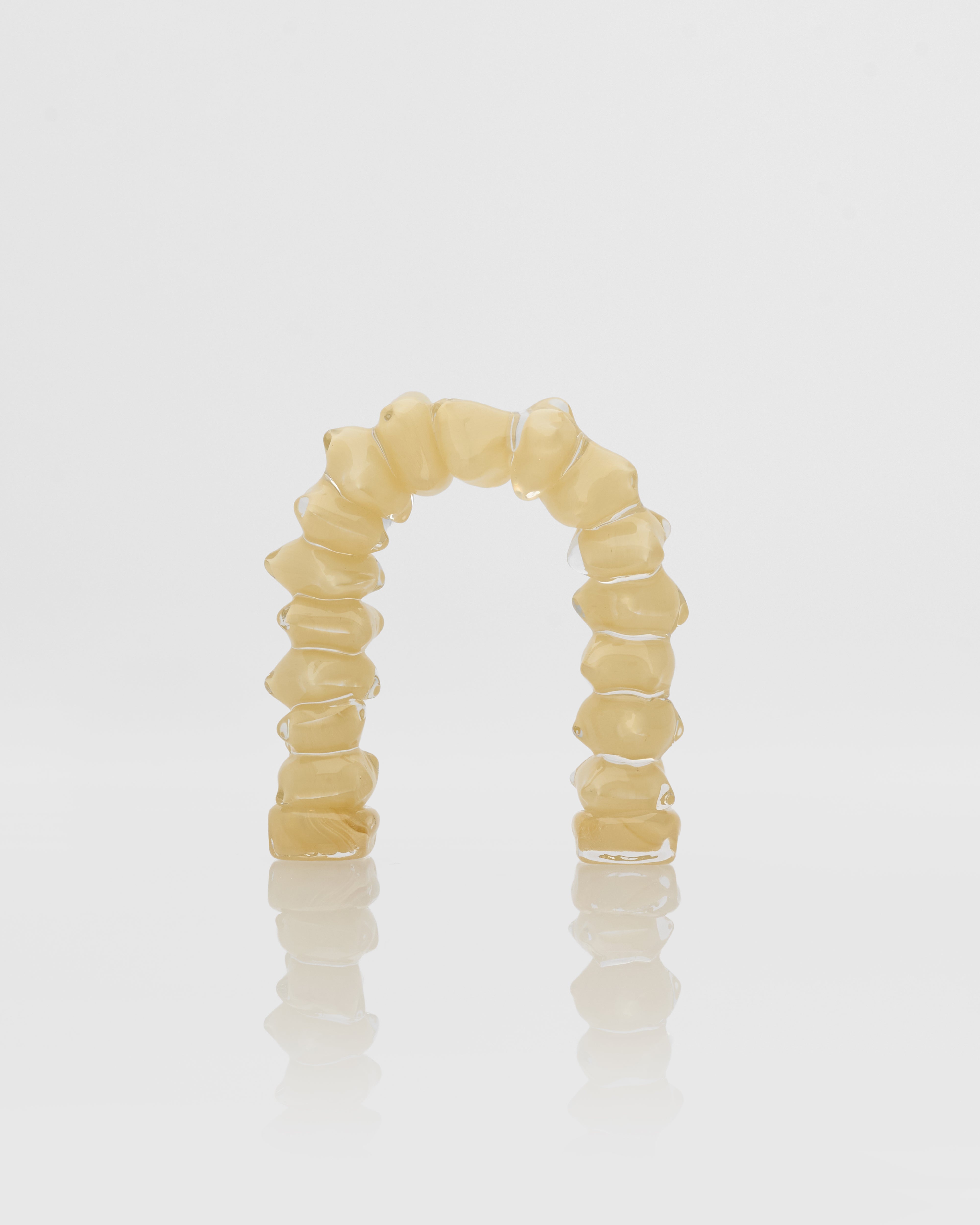 Beige marble stone ring on a white background