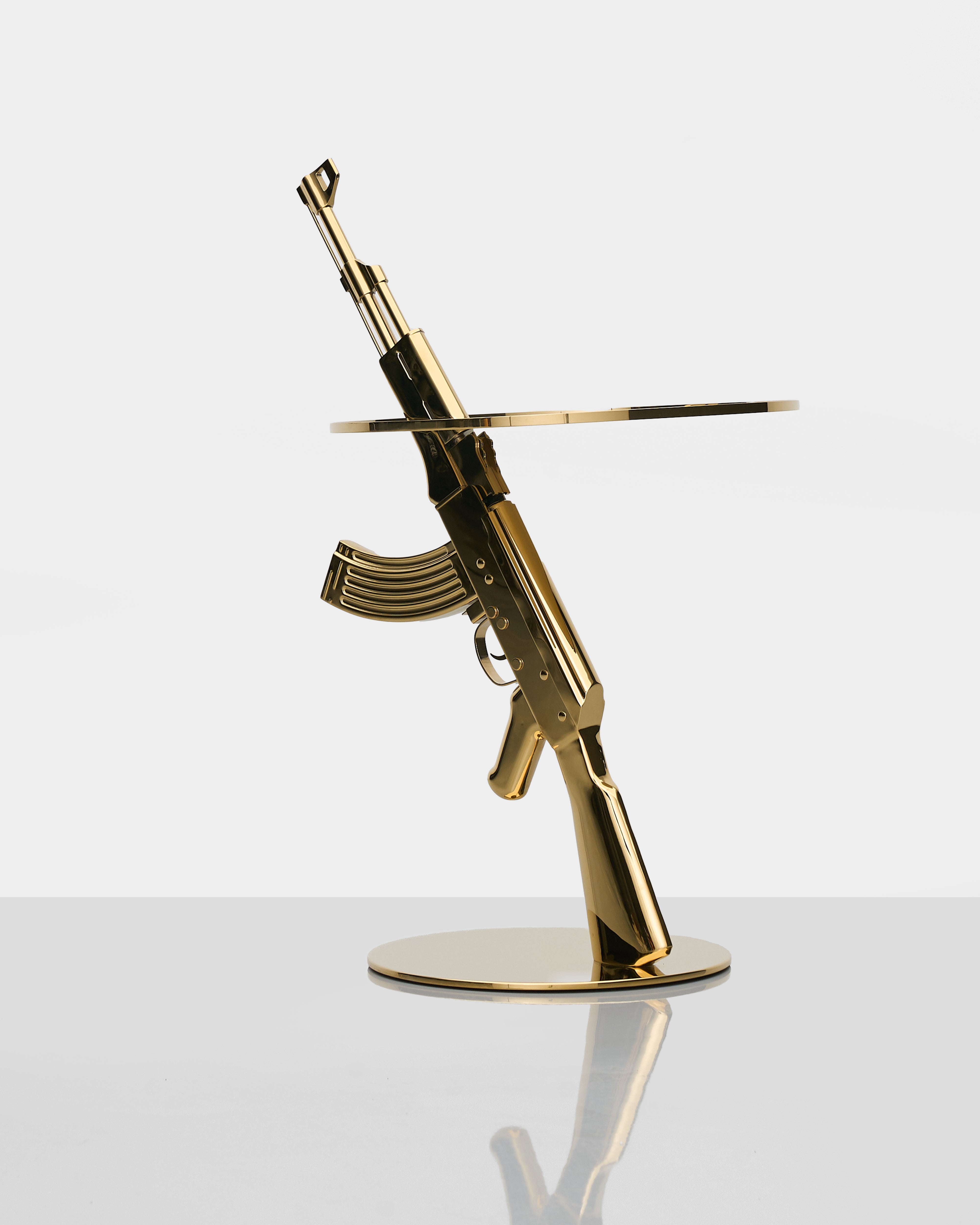 Bolt Side Table angled view showing refined golden finish and unique gun-inspired design elements