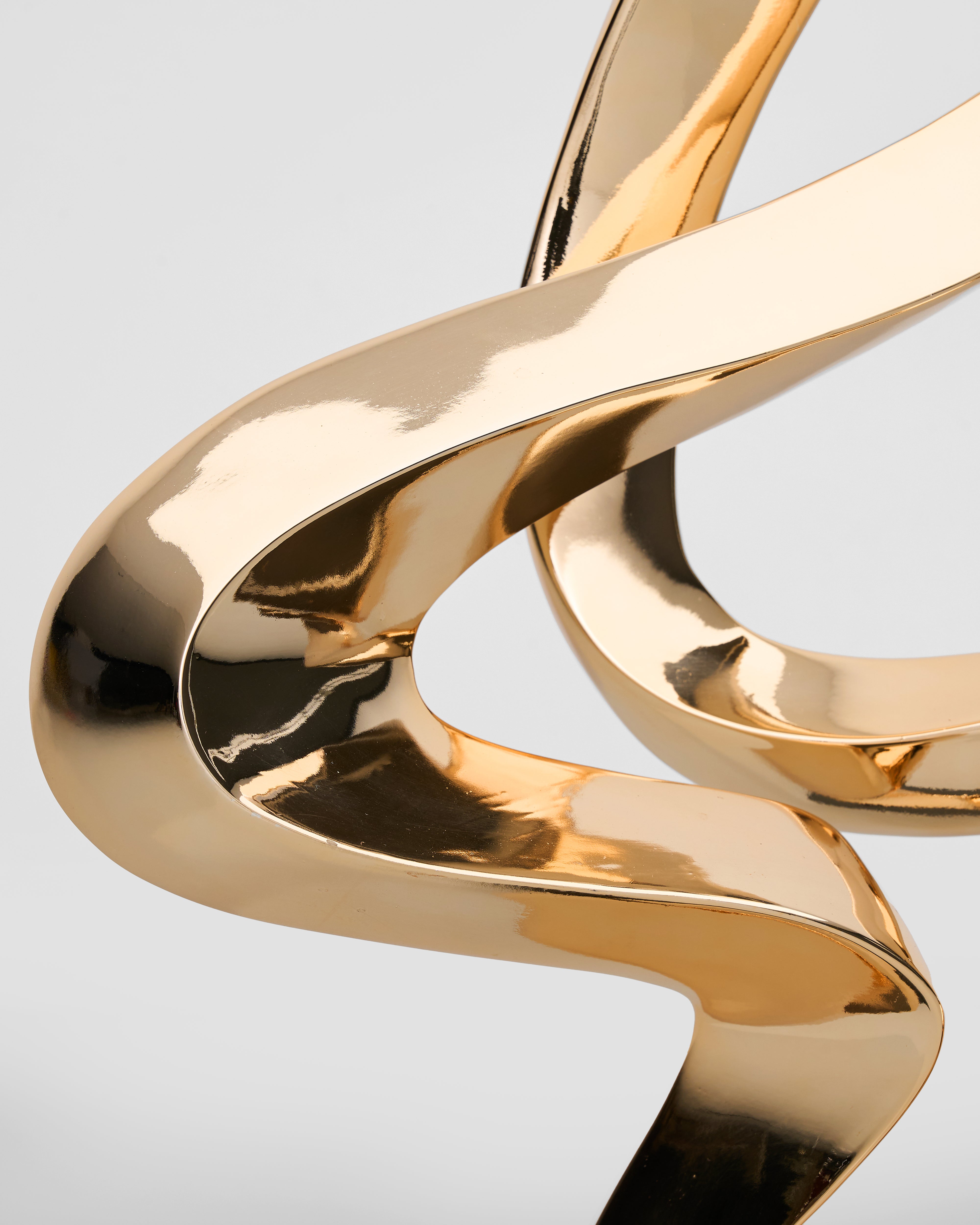 Close-up of Contemporary Flow Curve Sculpture detailing rose gold texture and refined craftsmanship