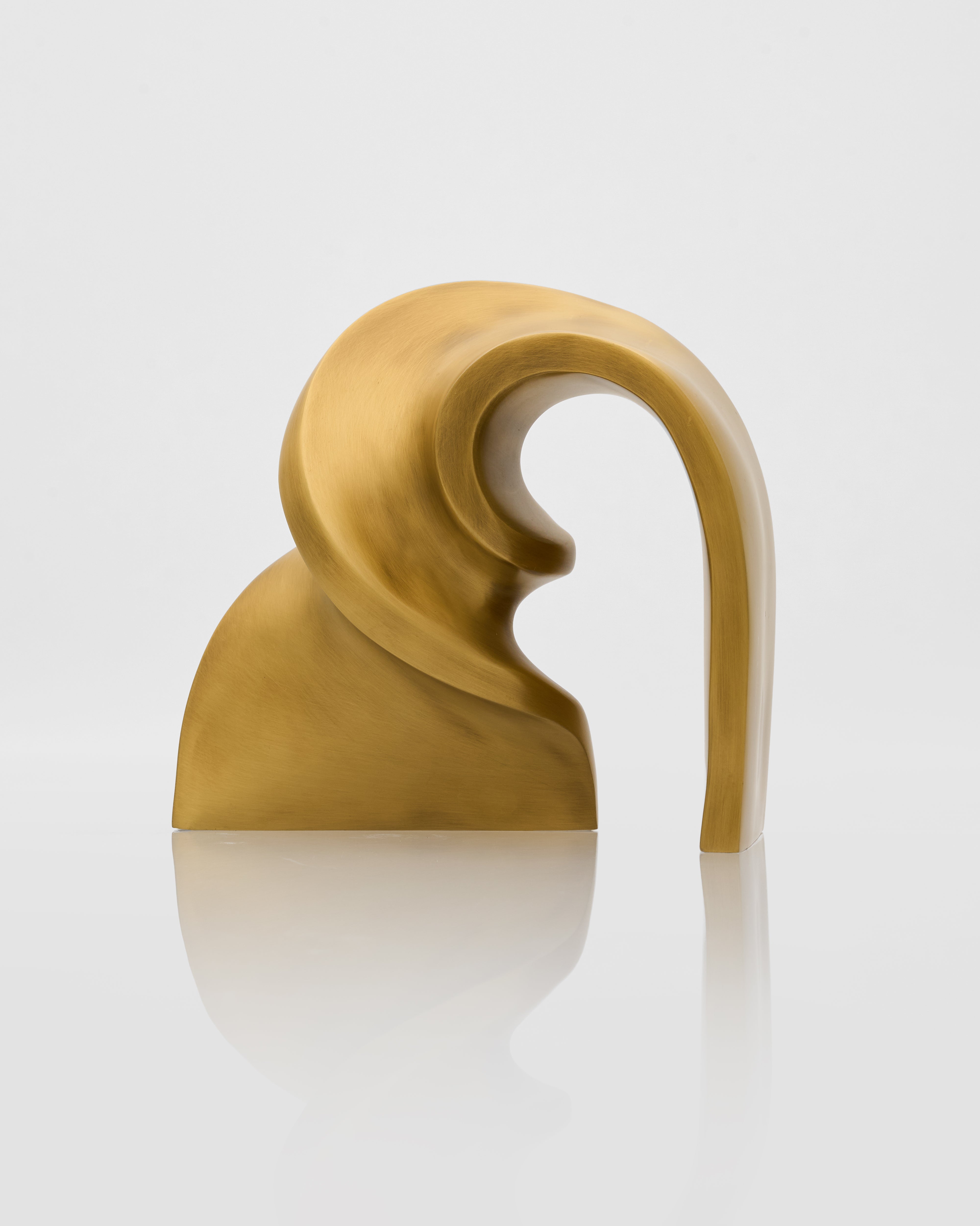 Gold-colored earbud on a white background