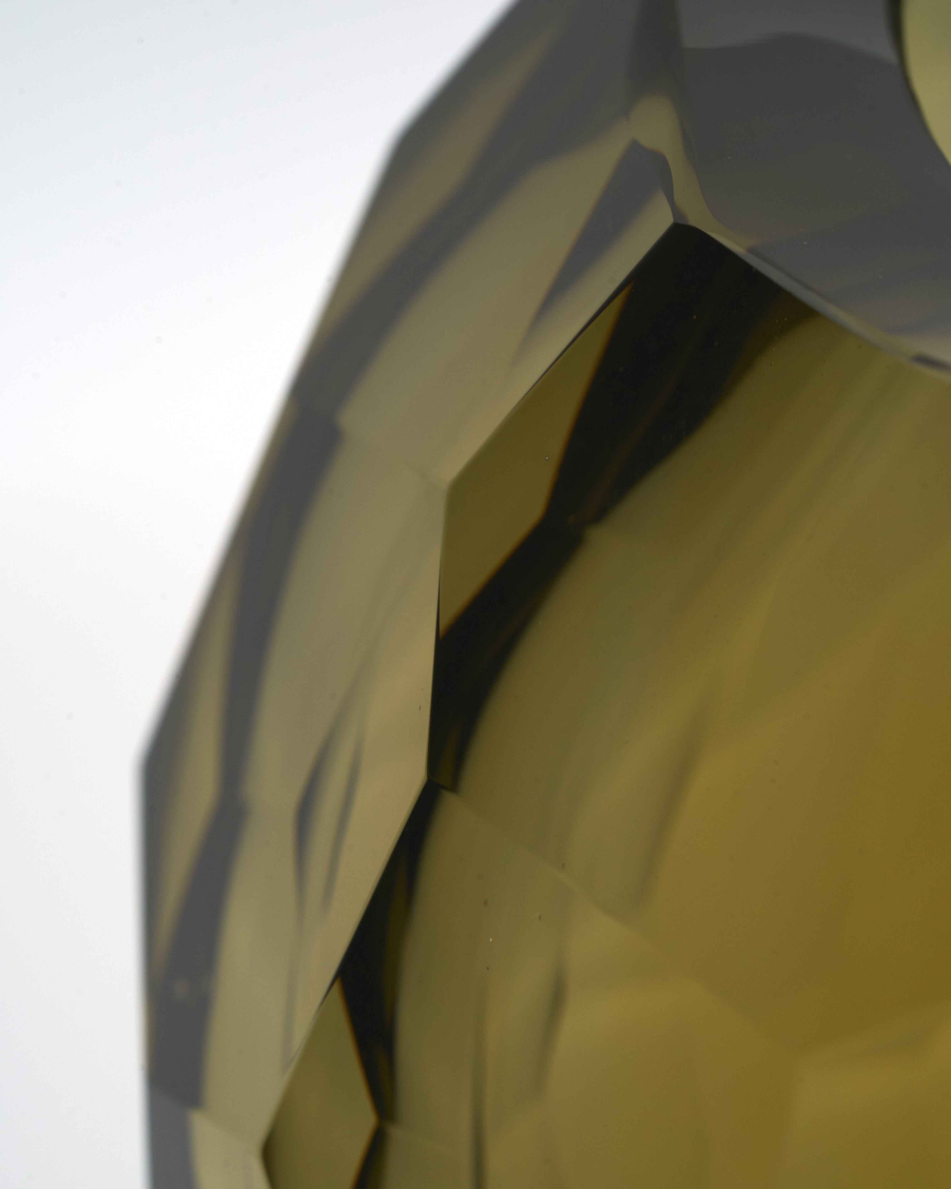 Detailed view of crystal-cut brown vase bowl focusing on sharp crystal edges and polished luxury finish