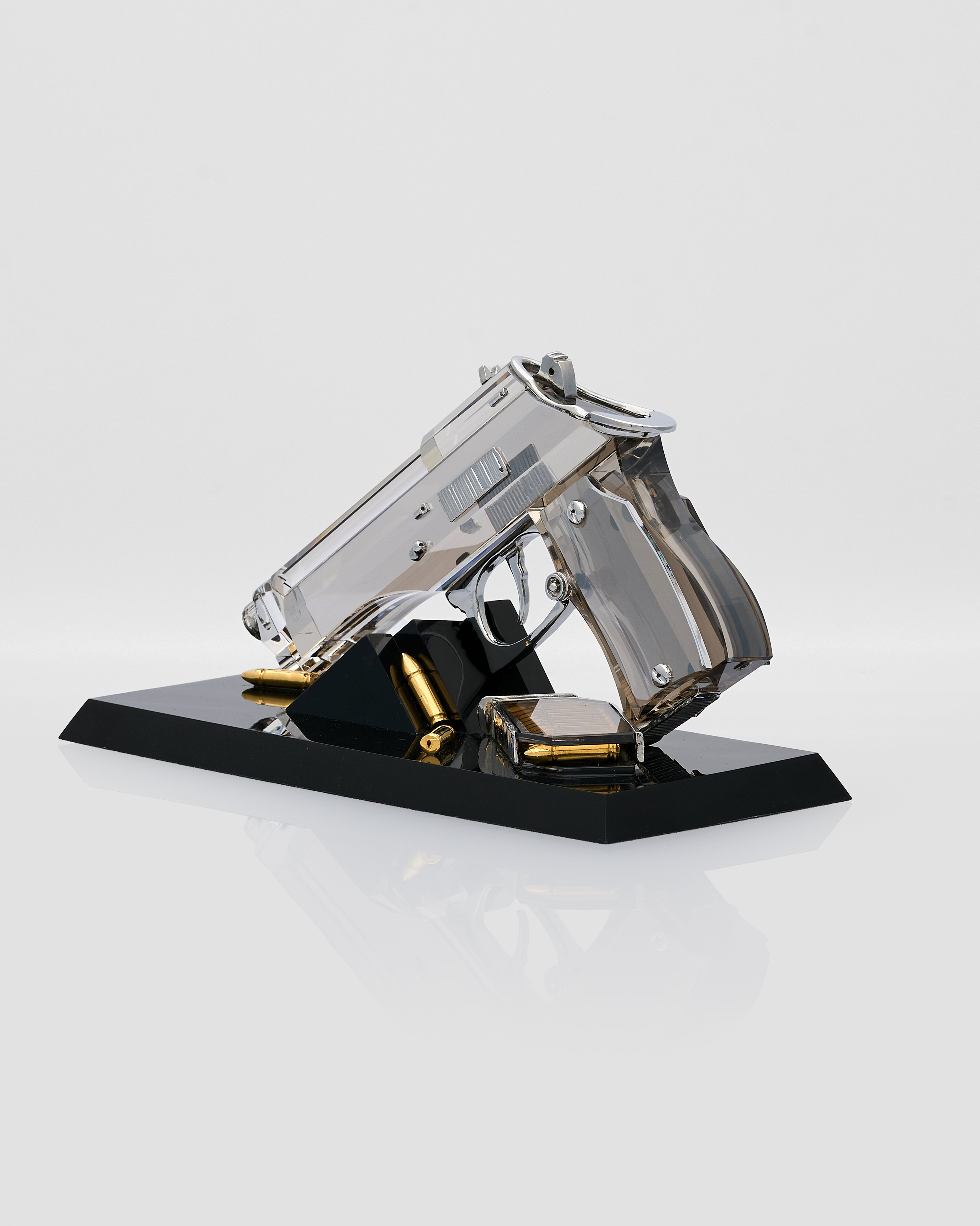 crystal decorative gun shaped model on a black stand