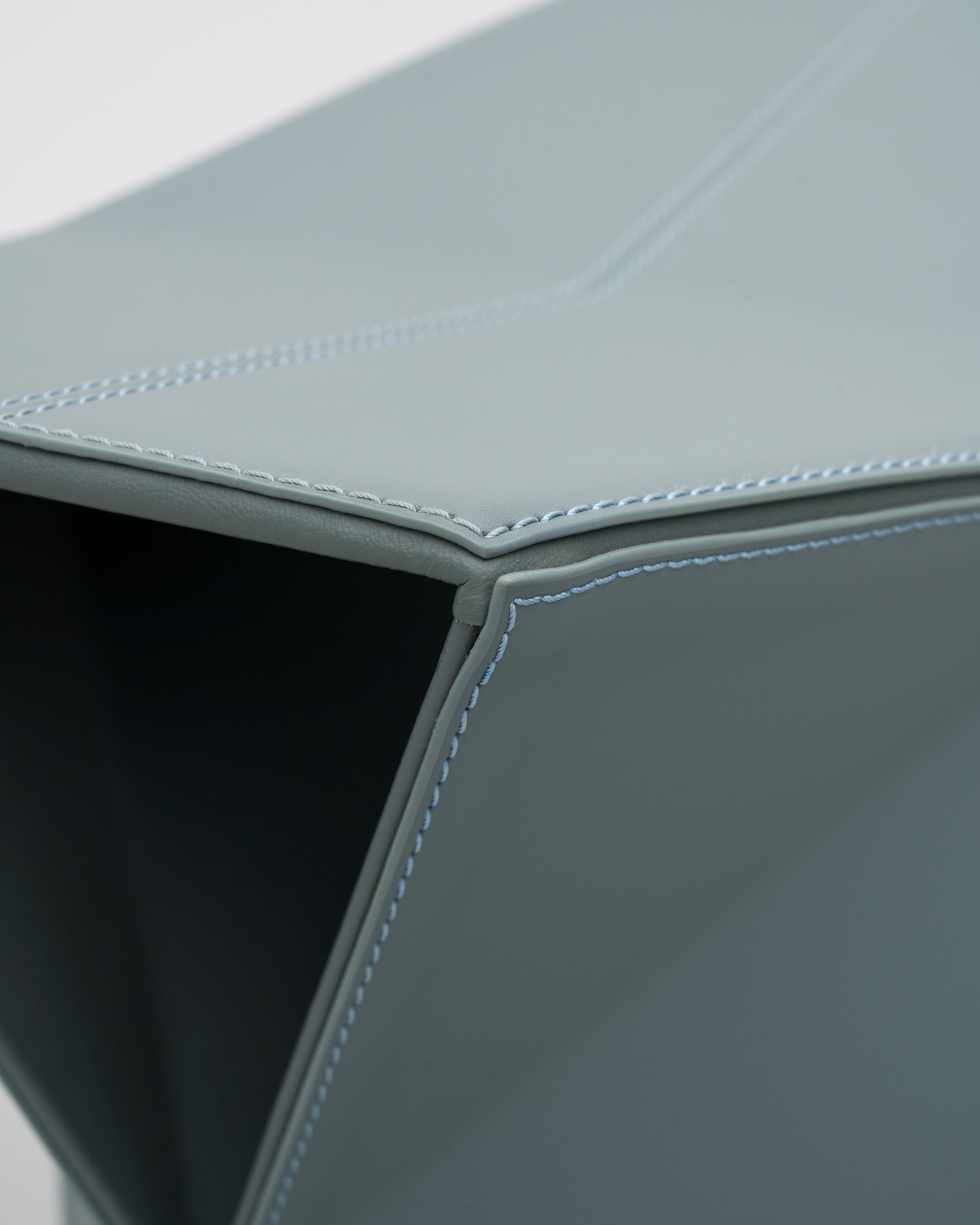 Detailed view of Diamond-Form Conical Leather Side Table emphasizing conical shape and high-quality leather accents