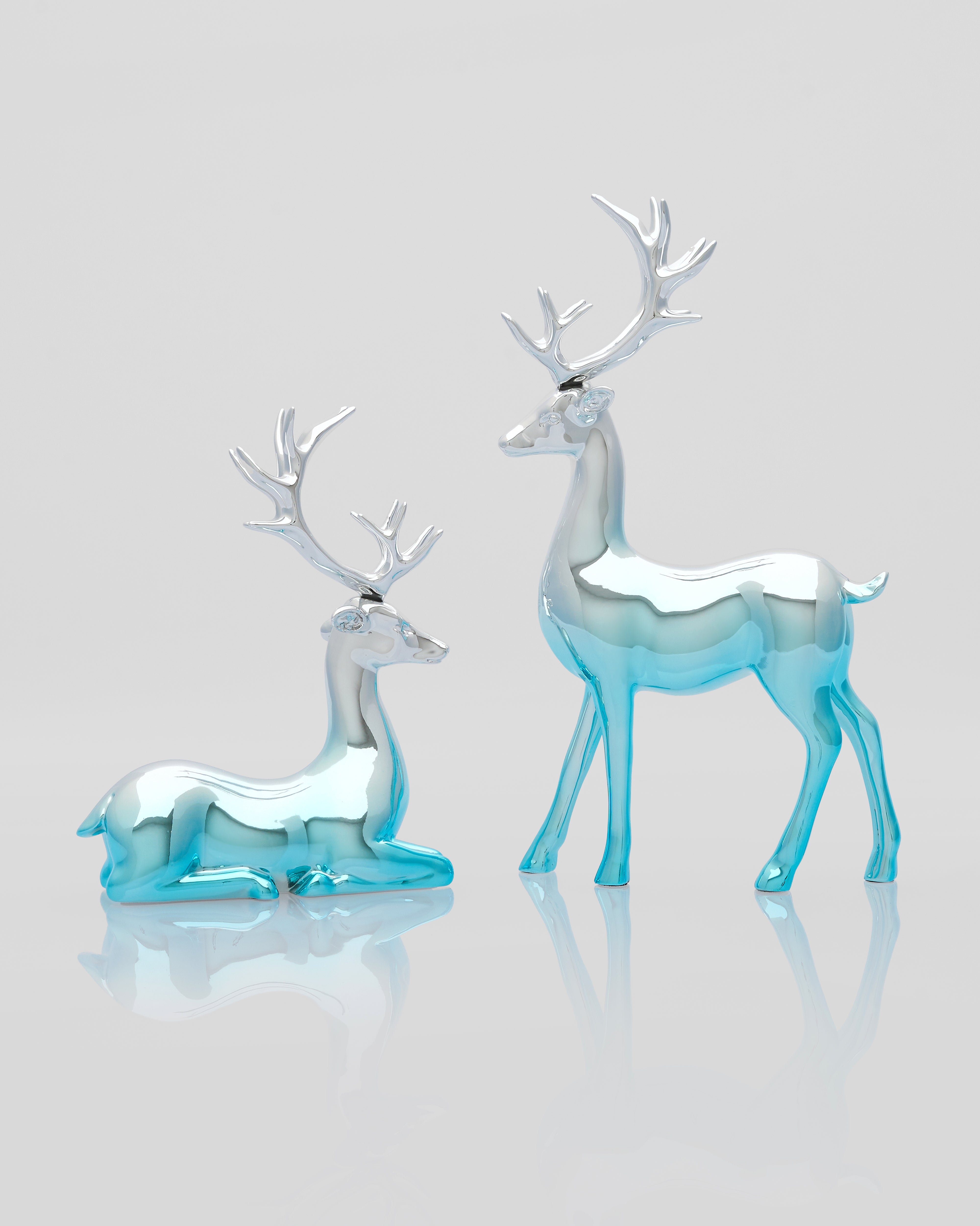 Close-up of Dual Desert Deer Decor emphasizing resin craftsmanship and complementary silver-blue tones