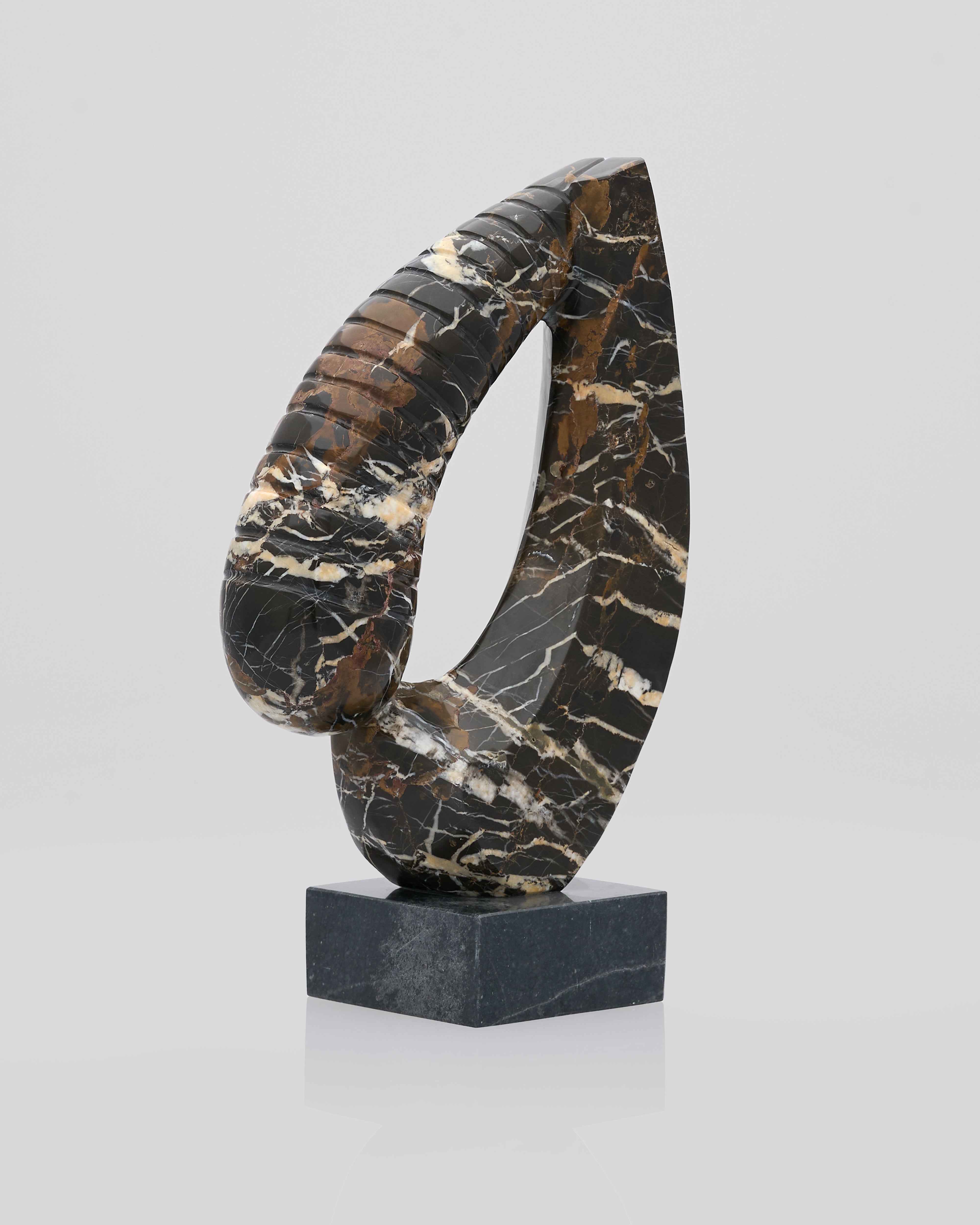 Elegant Heart marble sculpture angled view showing refined heart motif and contemporary design