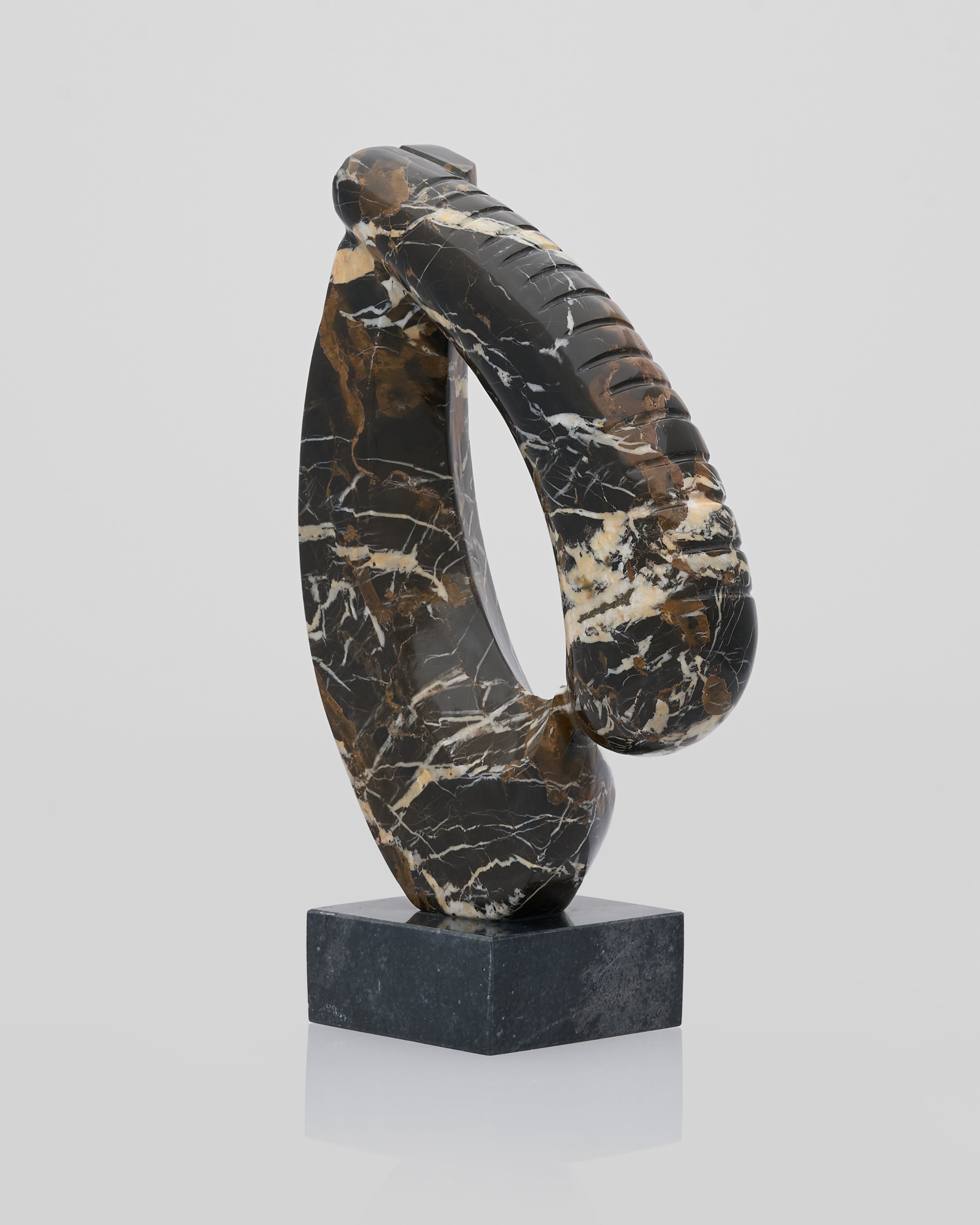 Side view of Elegant Heart marble sculpture highlighting smooth textured finish for premium interiors ©VIP Home Gallery