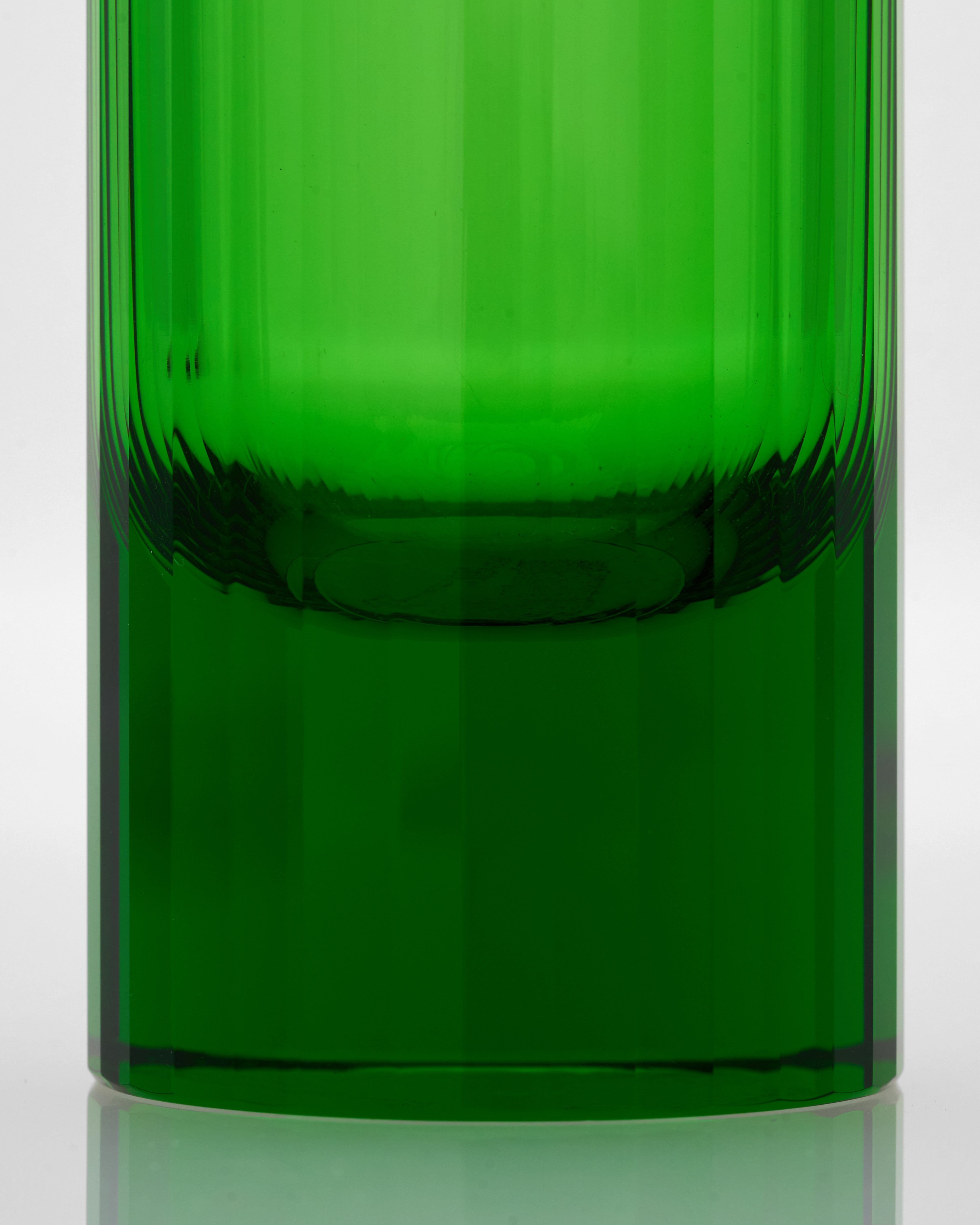Green glass vase on a white background