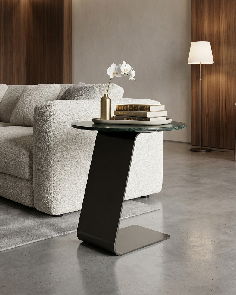 Modern living room with a gray sofa, side table, and decorative items.