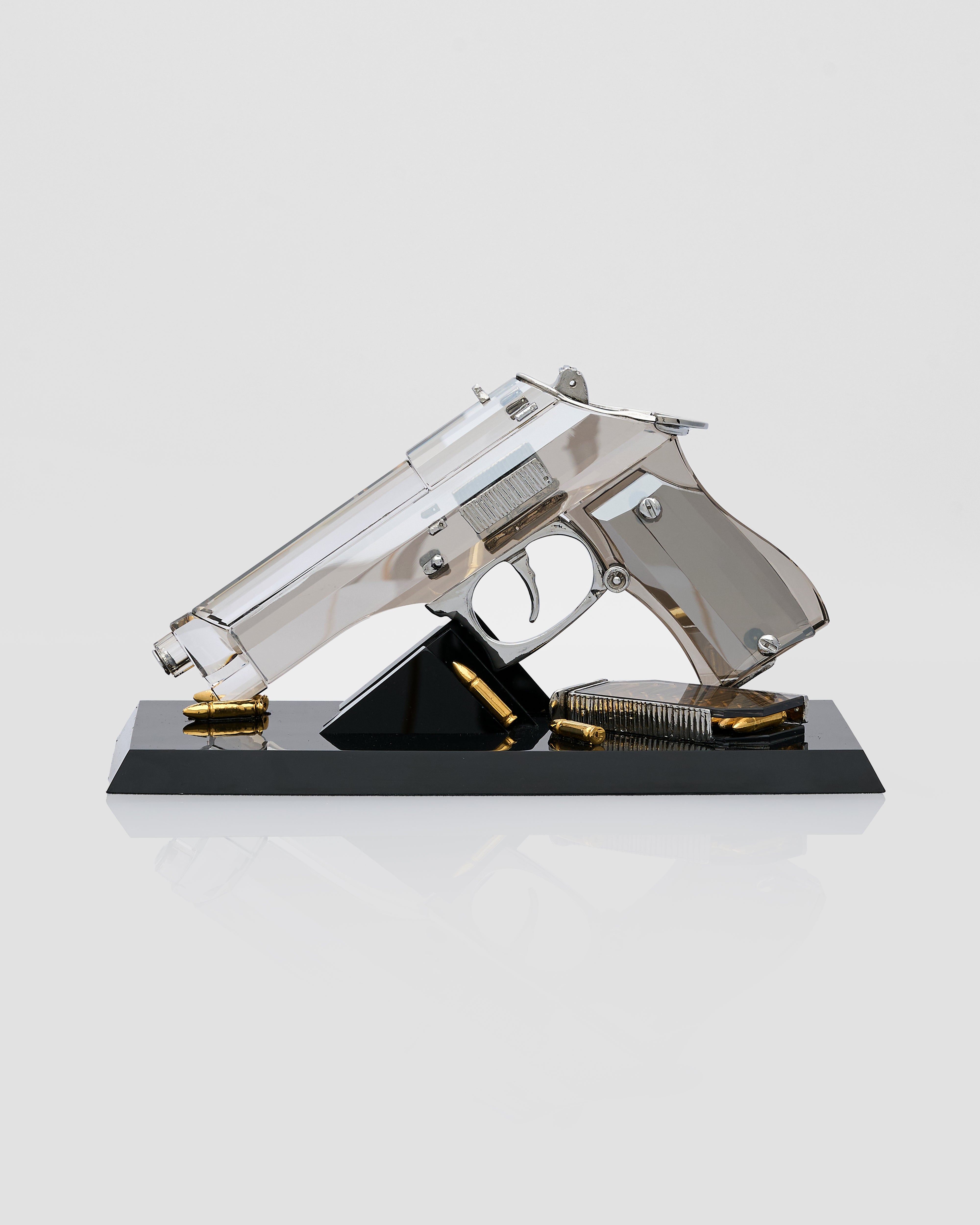 Crystal gun model on a black base