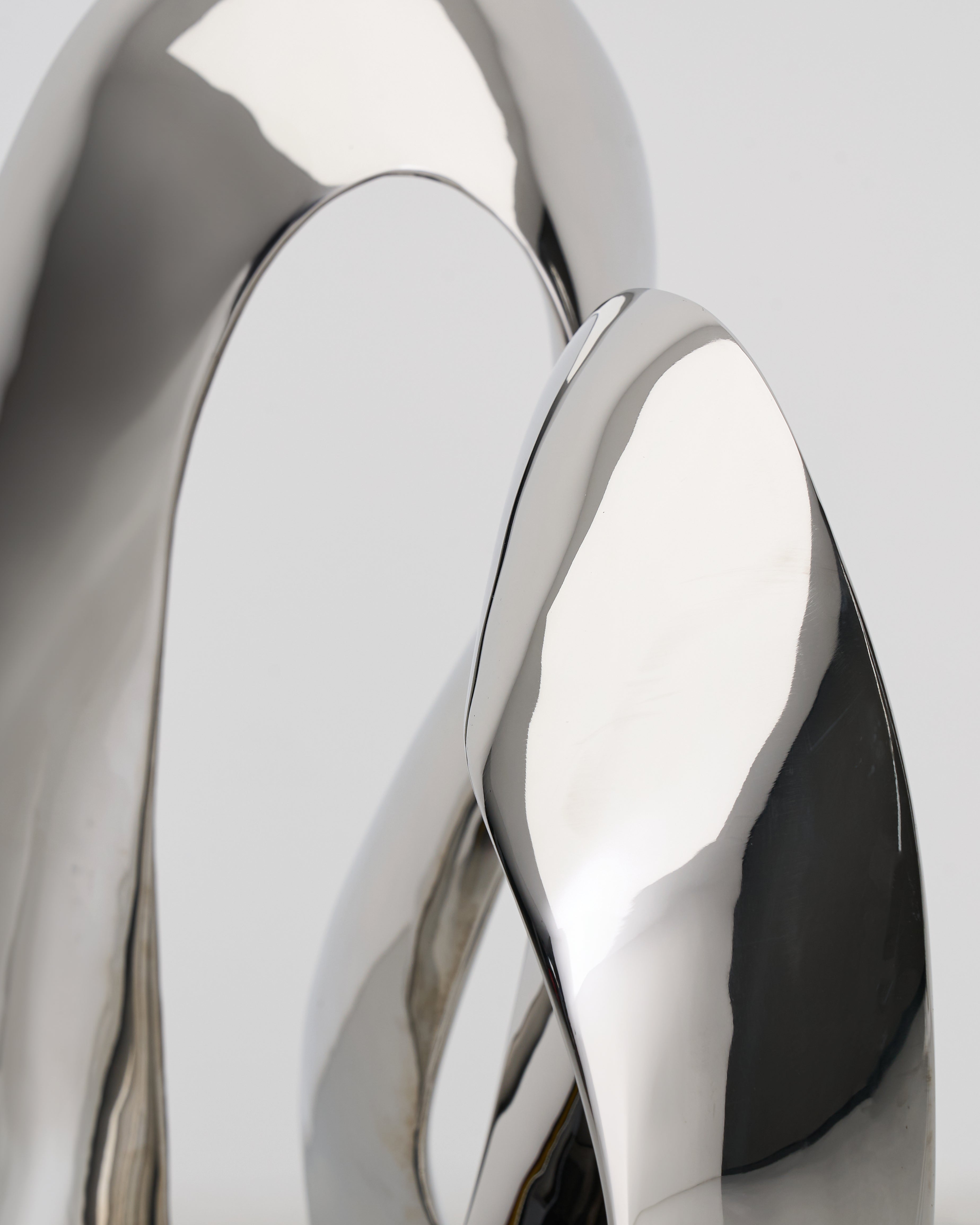Detailed view of Infinite Large Sculpture emphasizing sculptural curves and luxury finish
