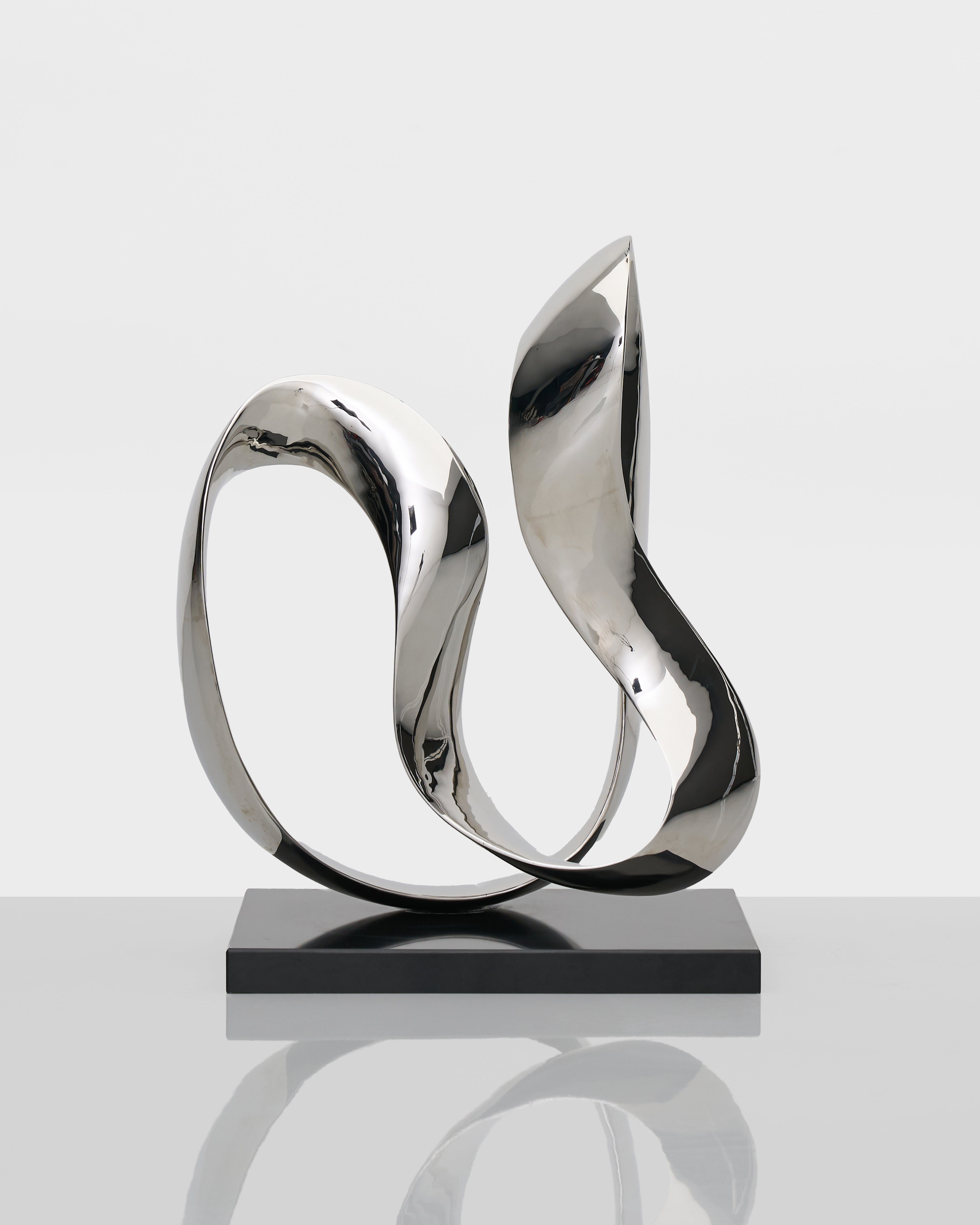 Infinite Large Sculpture luxury home accent in lustrous silver tones with contemporary artistic design