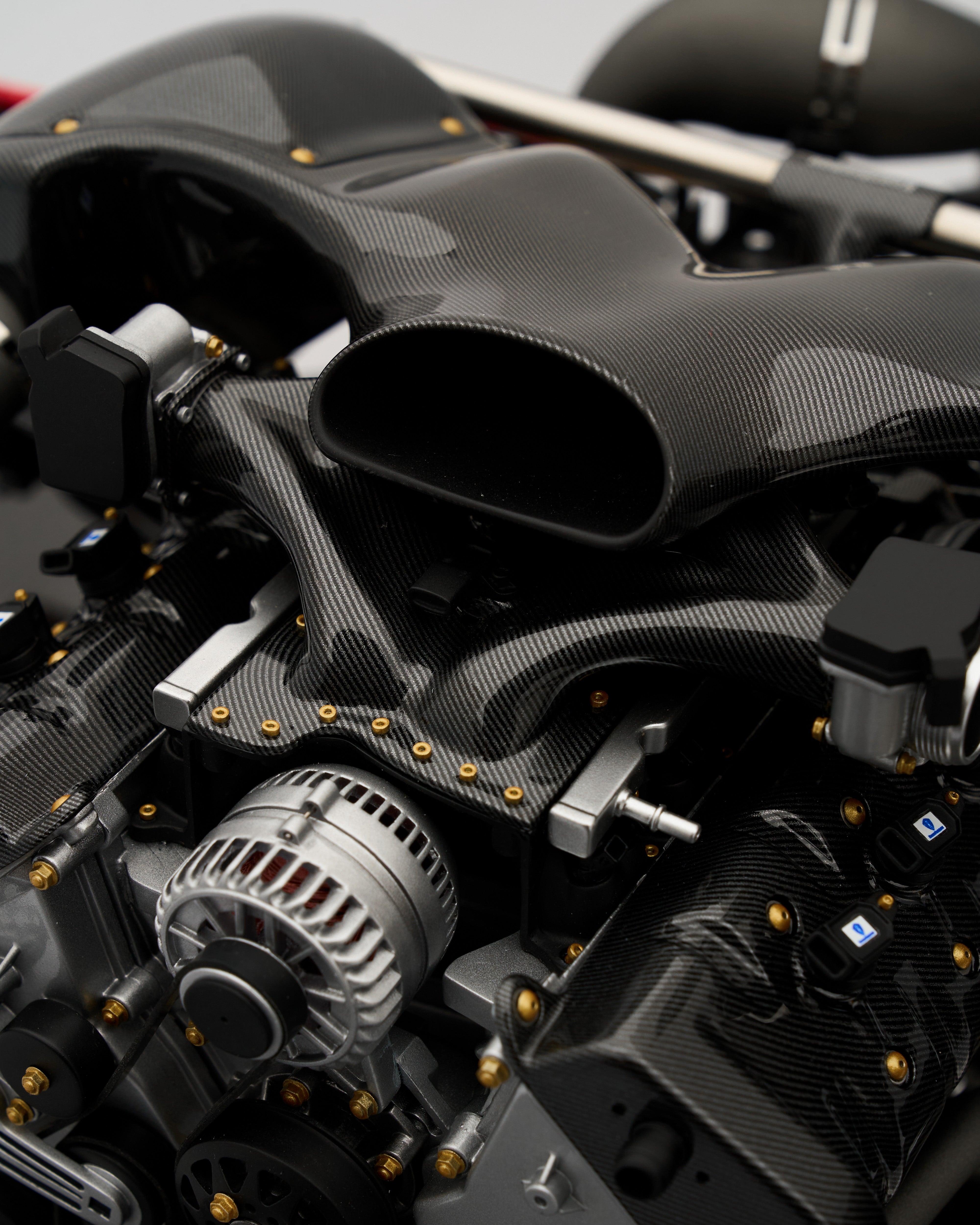 Close-up of a car engine with carbon fiber components
