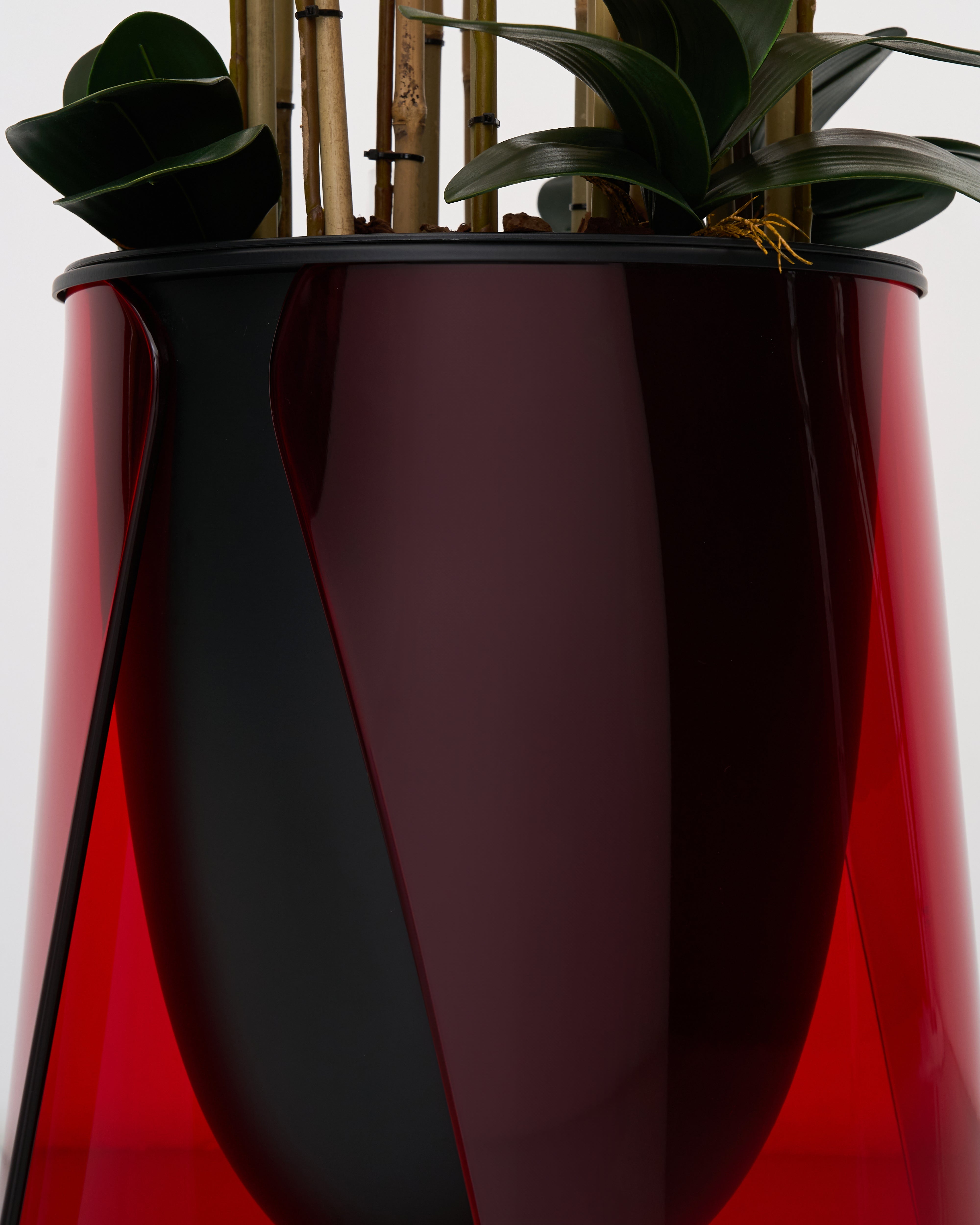 Detailed view of Lark Planter emphasizing curved stand design and luxurious finish