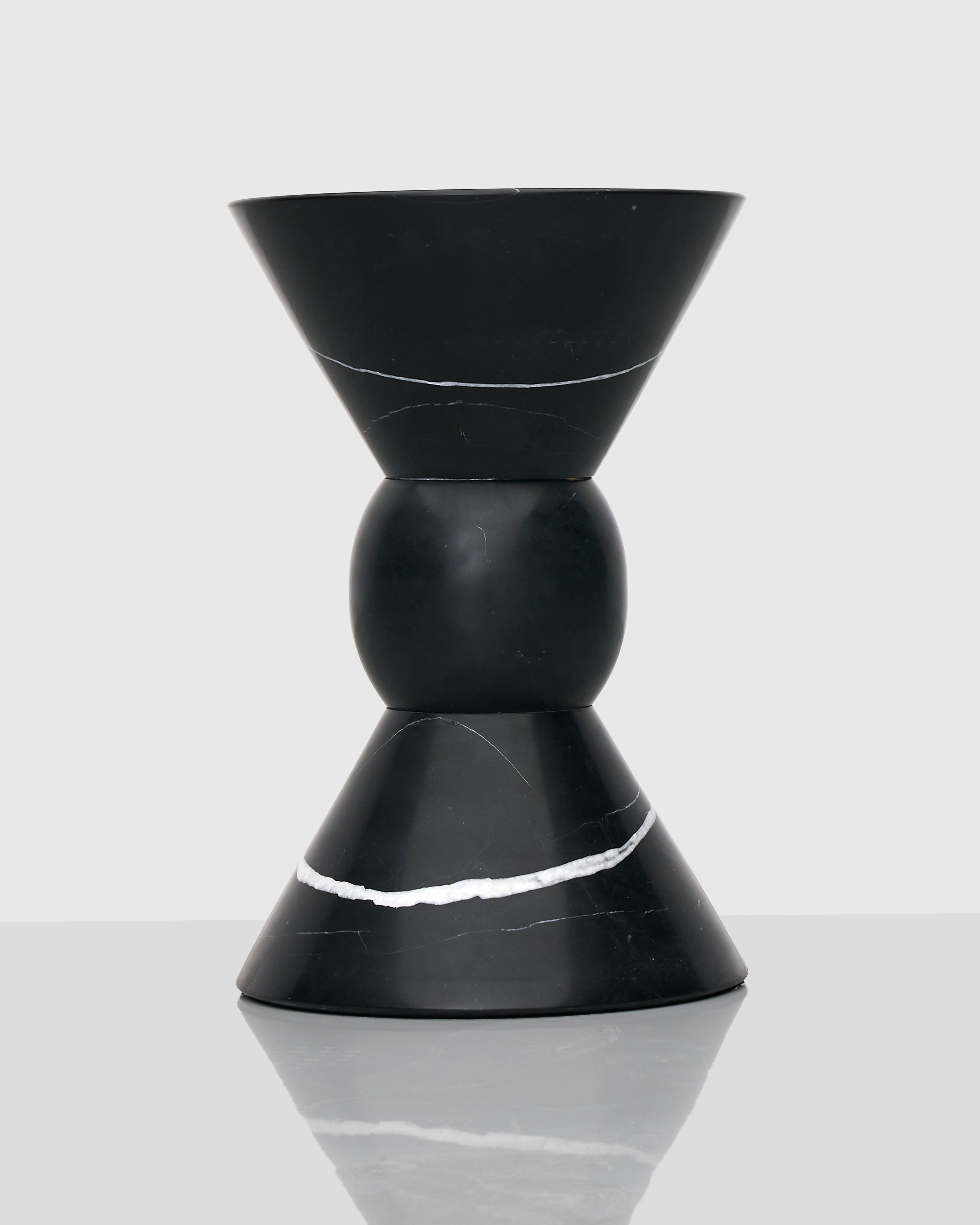 Side view of Oto Marble Side Table highlighting minimalist silhouette and solid marble construction