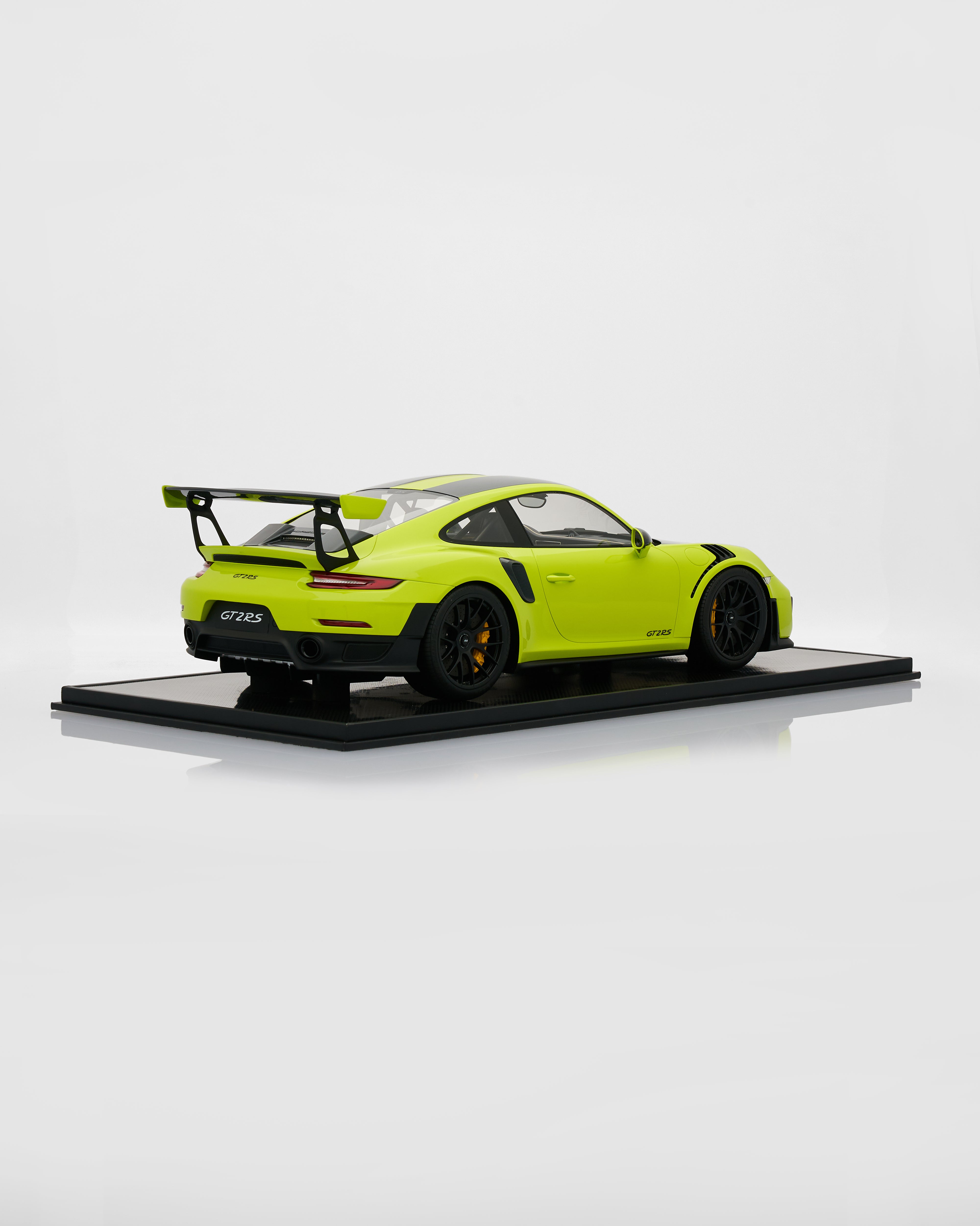 Side view of Porsche 911 GT2RS Acid Green limited edition scale model highlighting aggressive stance and premium detailing