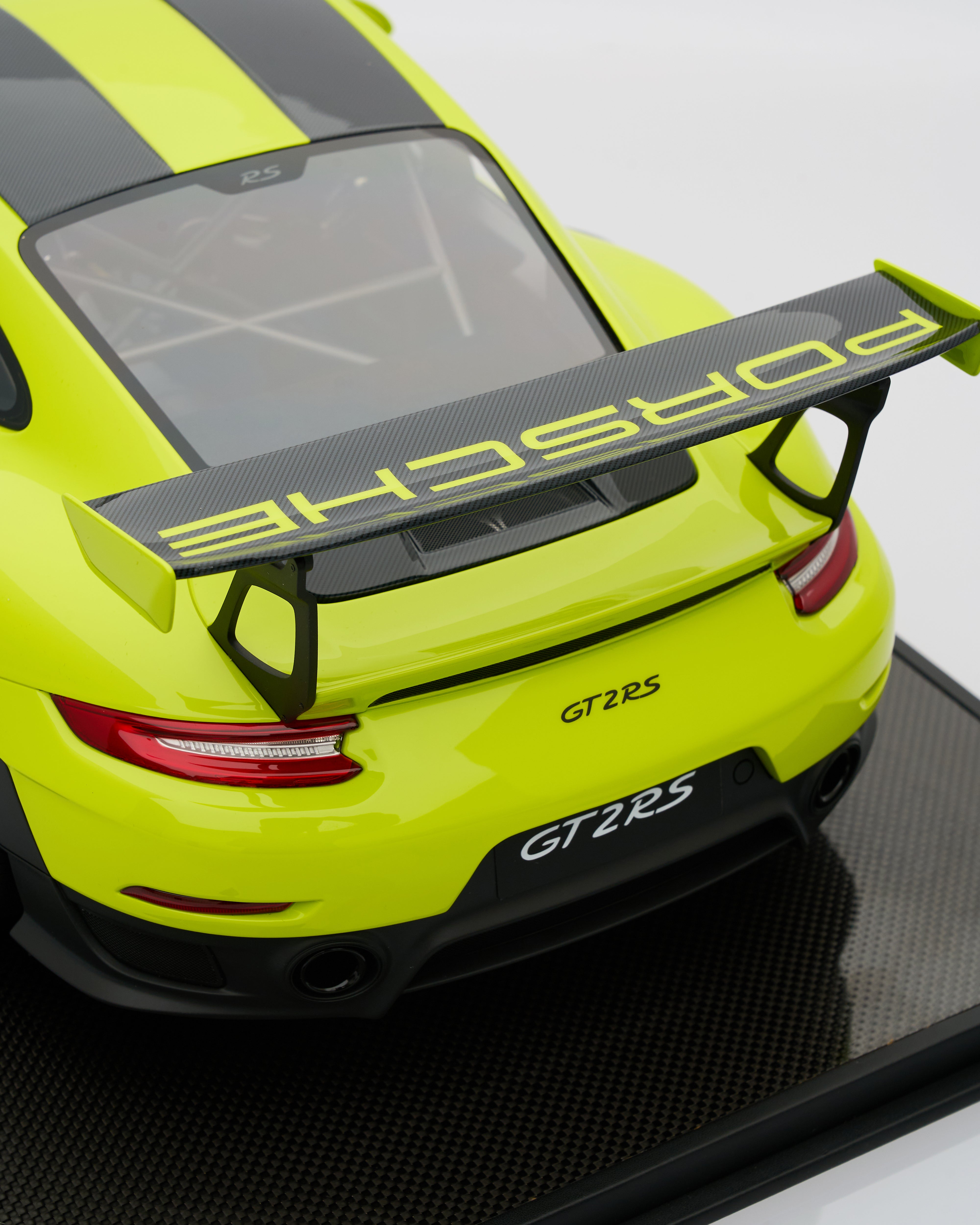 Side view of Porsche 911 GT2RS Acid Green limited edition scale model highlighting aggressive stance and premium detailing
