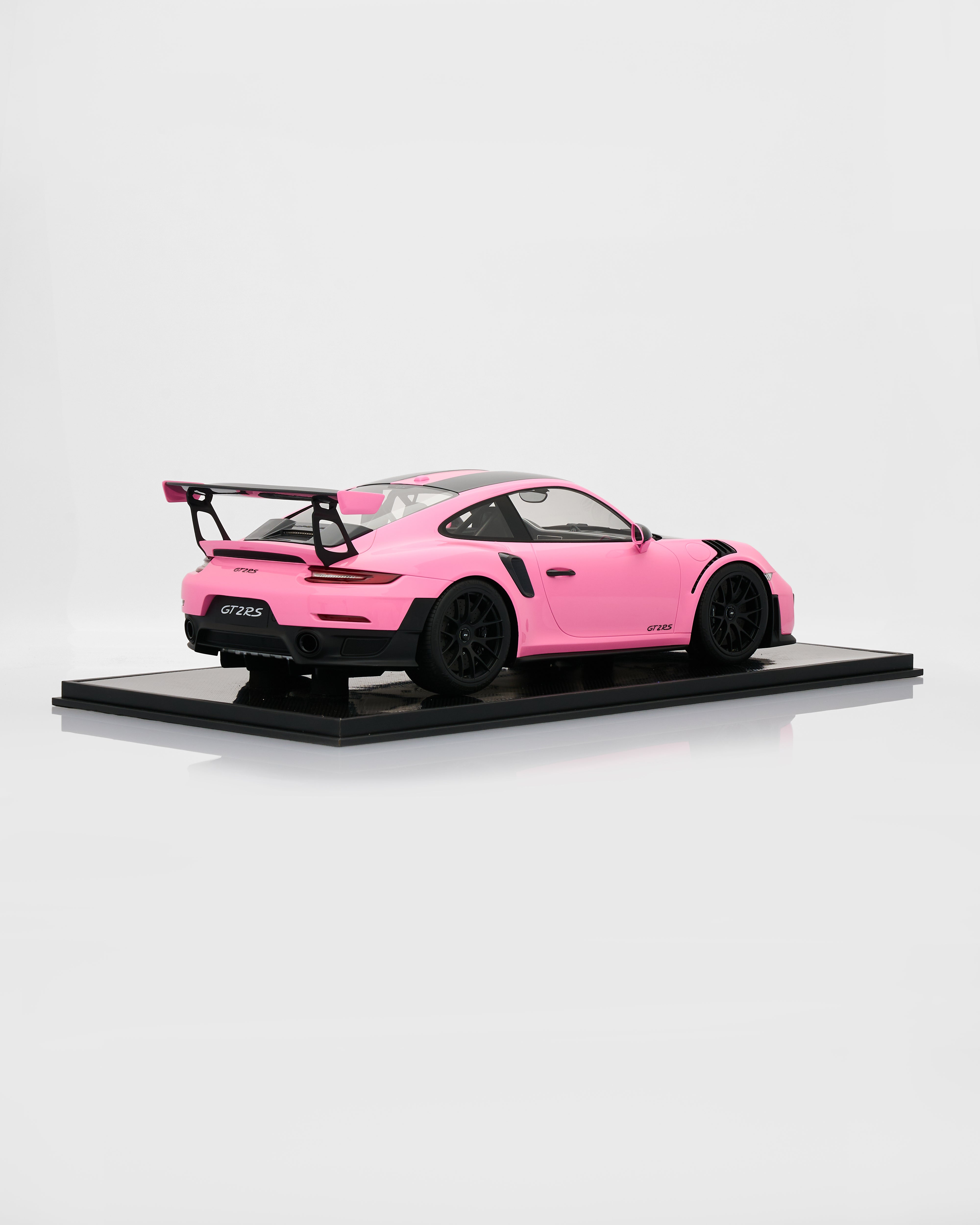 Pink model car on a white background