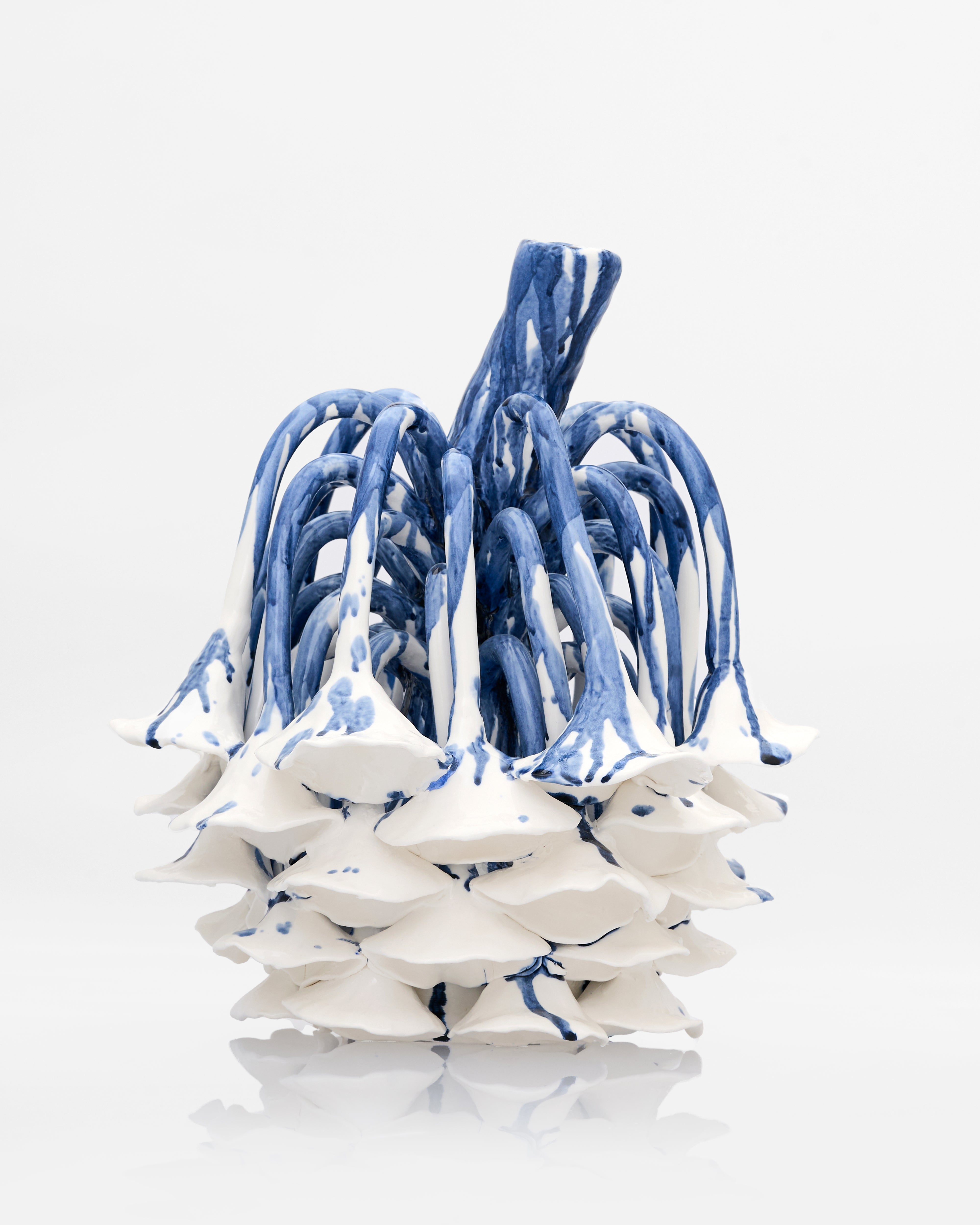 Radicle Decor with porcelain-like metal finish luxury home accent featuring modern abstract sculptural design