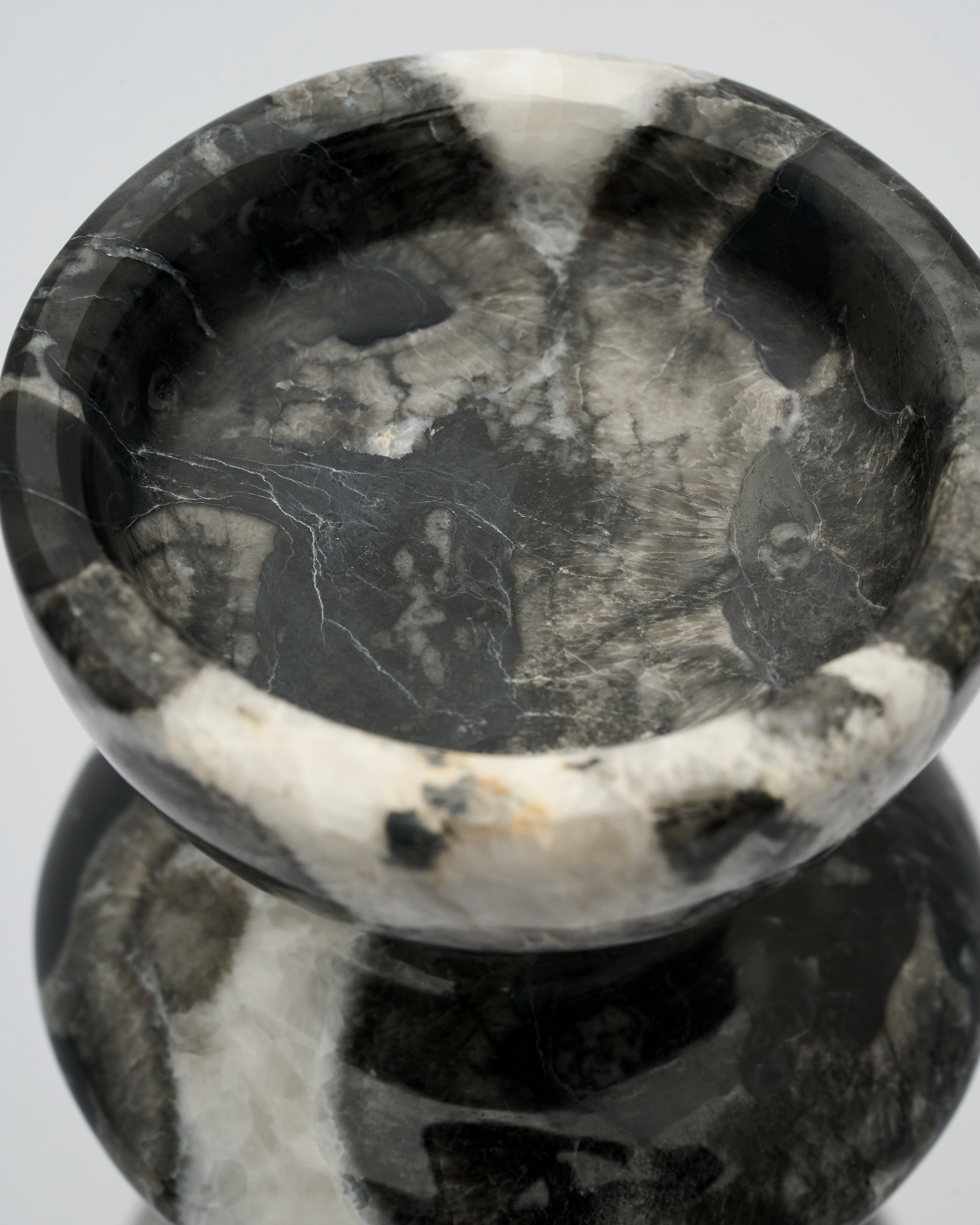 Detailed view of ripple marble candle holder emphasizing sculptural curves and luxury stone finish