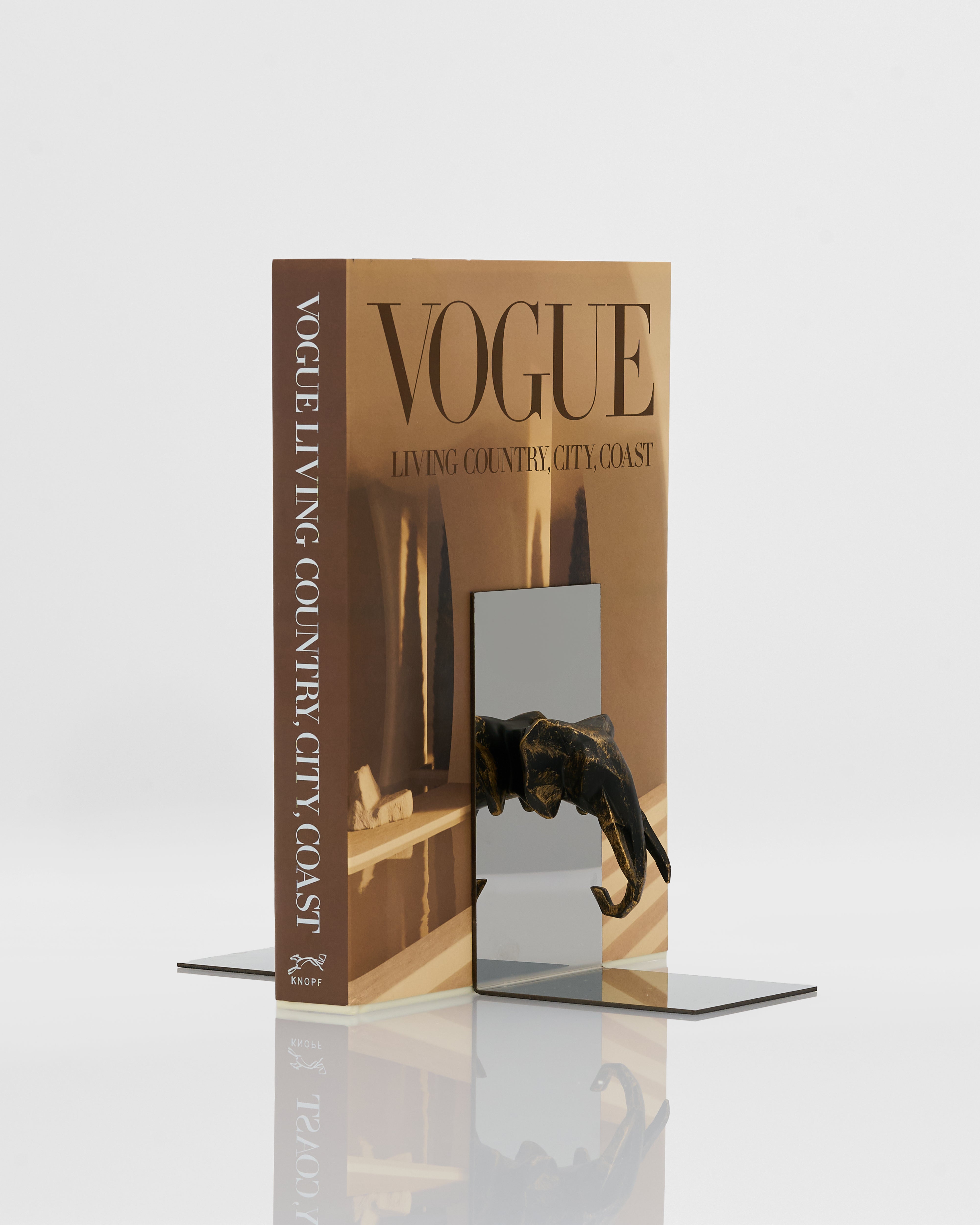 Symmetrical elephant bookend styled as luxury shelf accent for modern and classic interiors