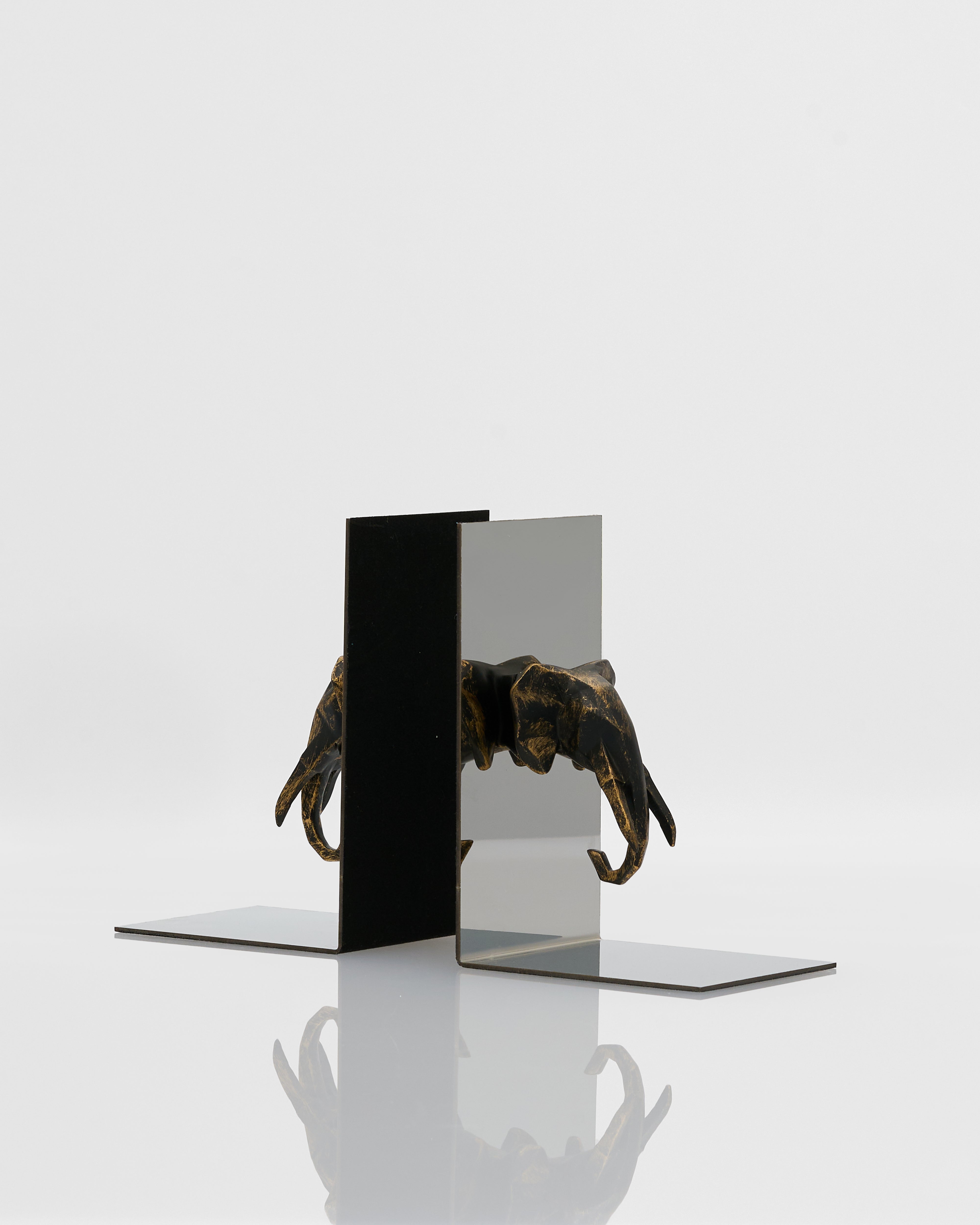 Side view of symmetrical elephant bookend highlighting detailed contours and premium finish