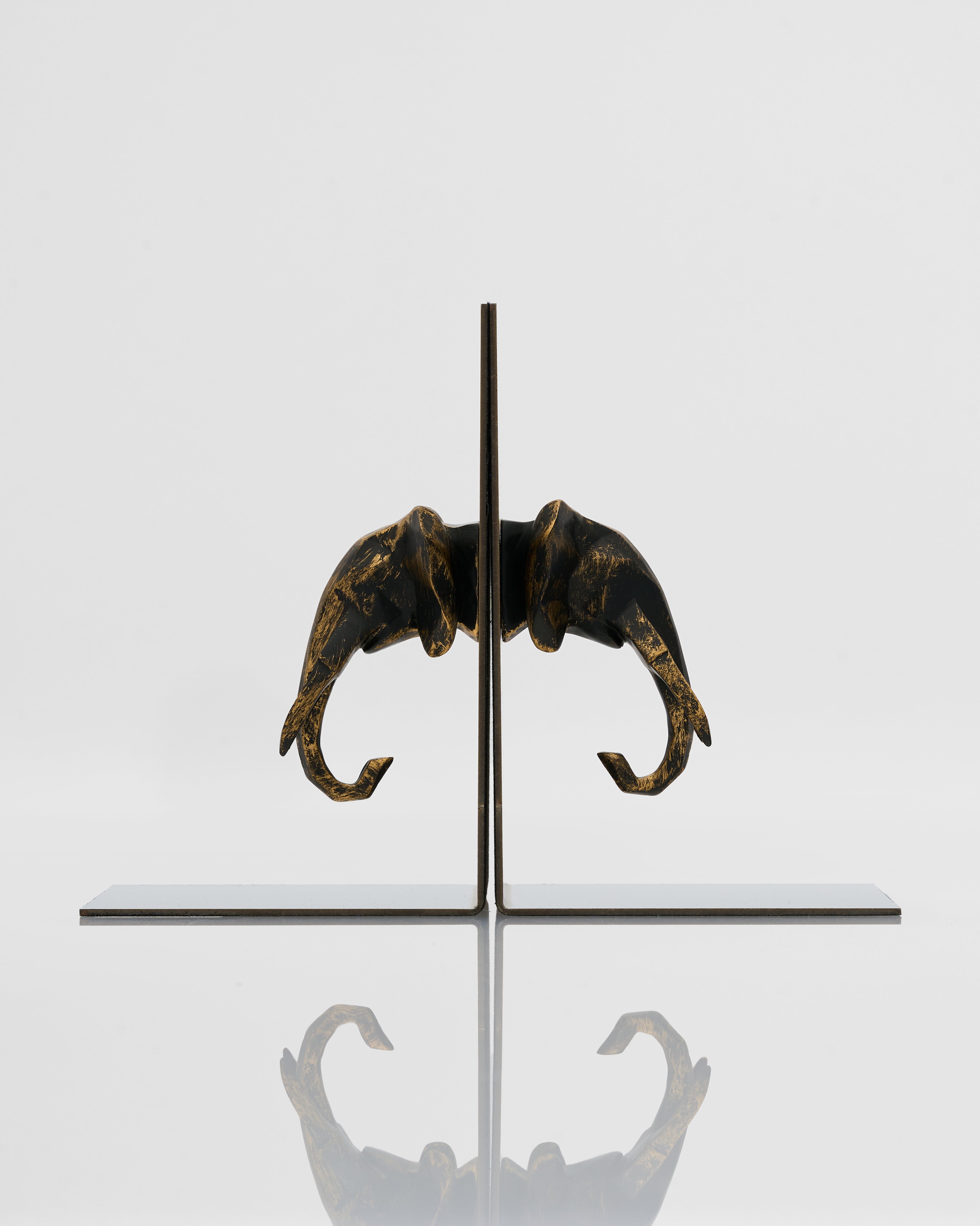 Side view of symmetrical elephant bookend highlighting detailed contours and premium finish